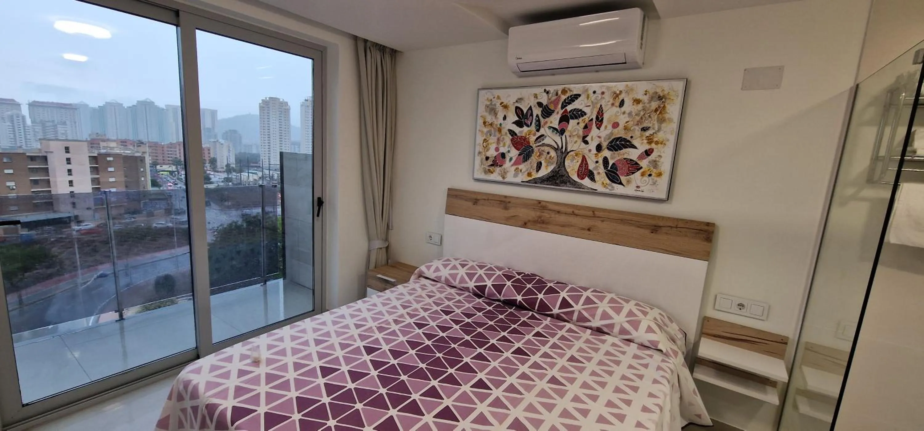 Bed in APARTAMENTOS OASIS DE LA CALA