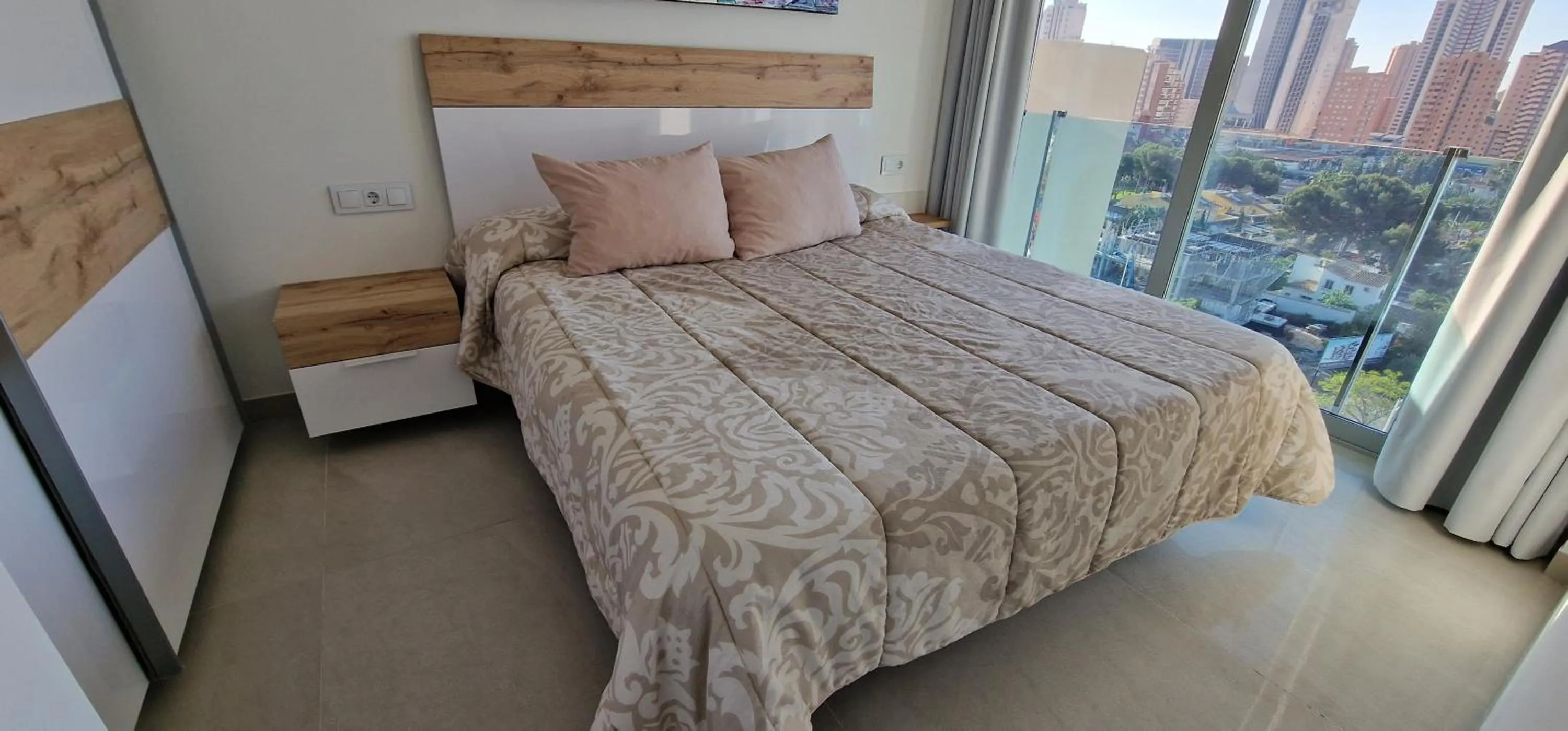 Bed in APARTAMENTOS OASIS DE LA CALA