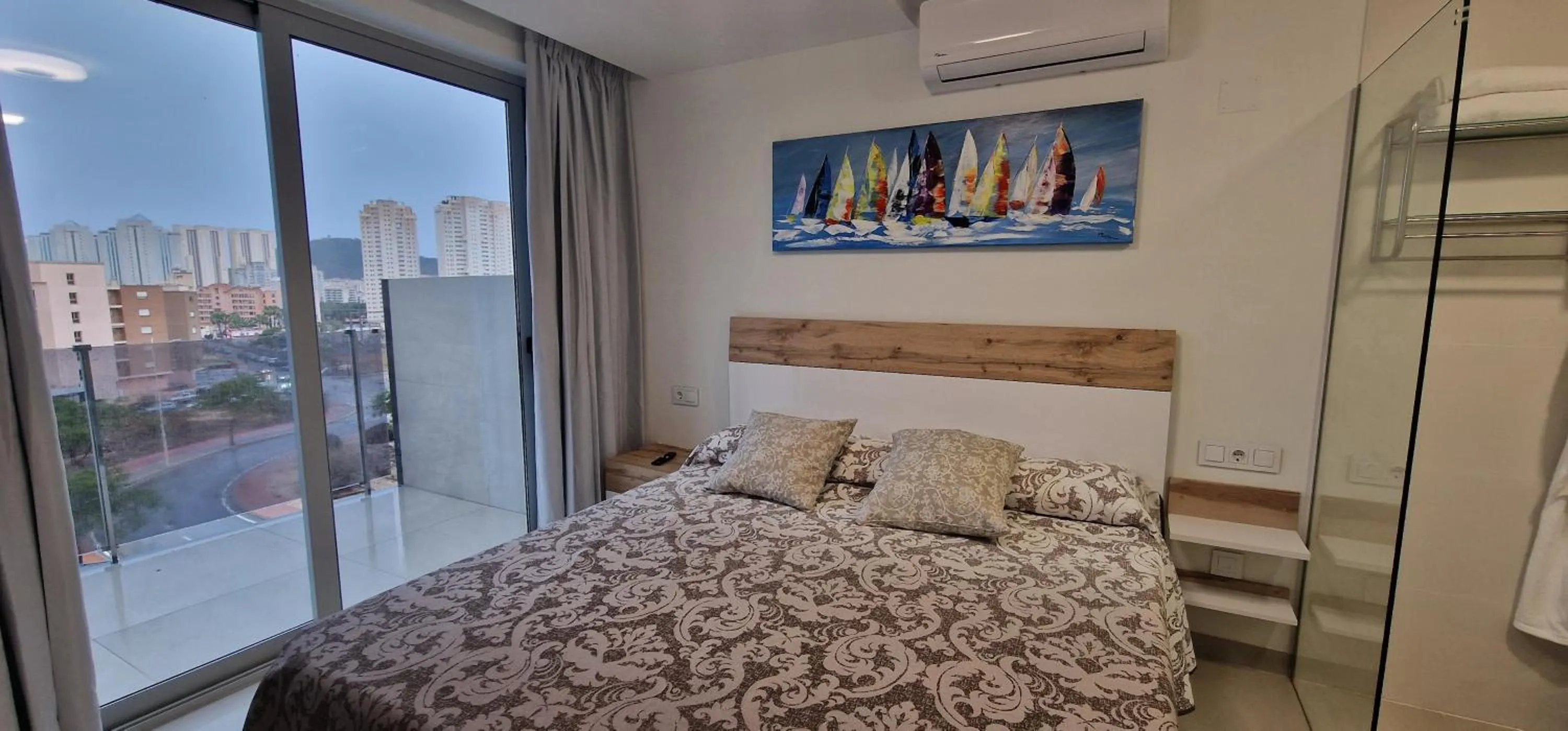 Bed in APARTAMENTOS OASIS DE LA CALA