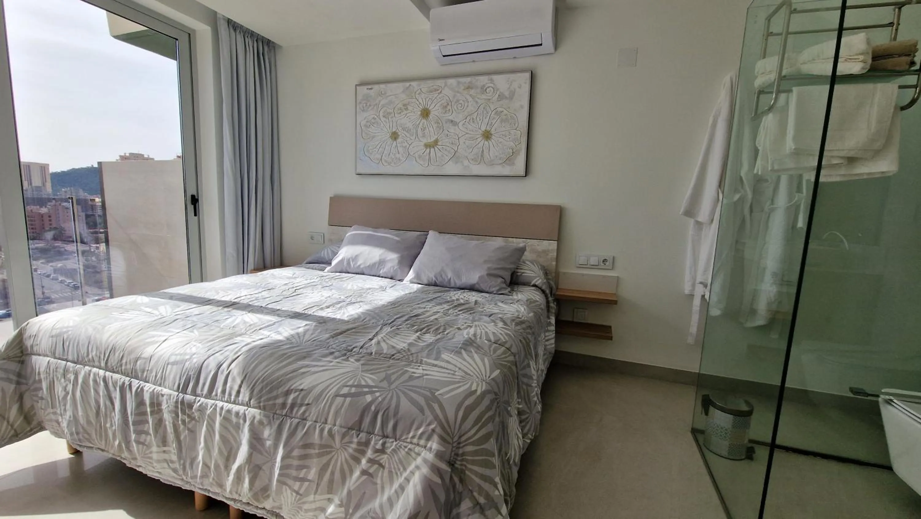 Bed in APARTAMENTOS OASIS DE LA CALA