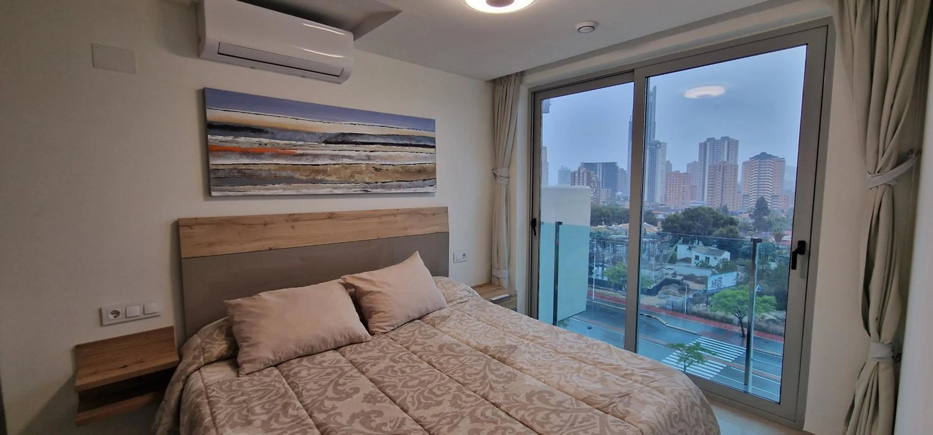 Bed in APARTAMENTOS OASIS DE LA CALA