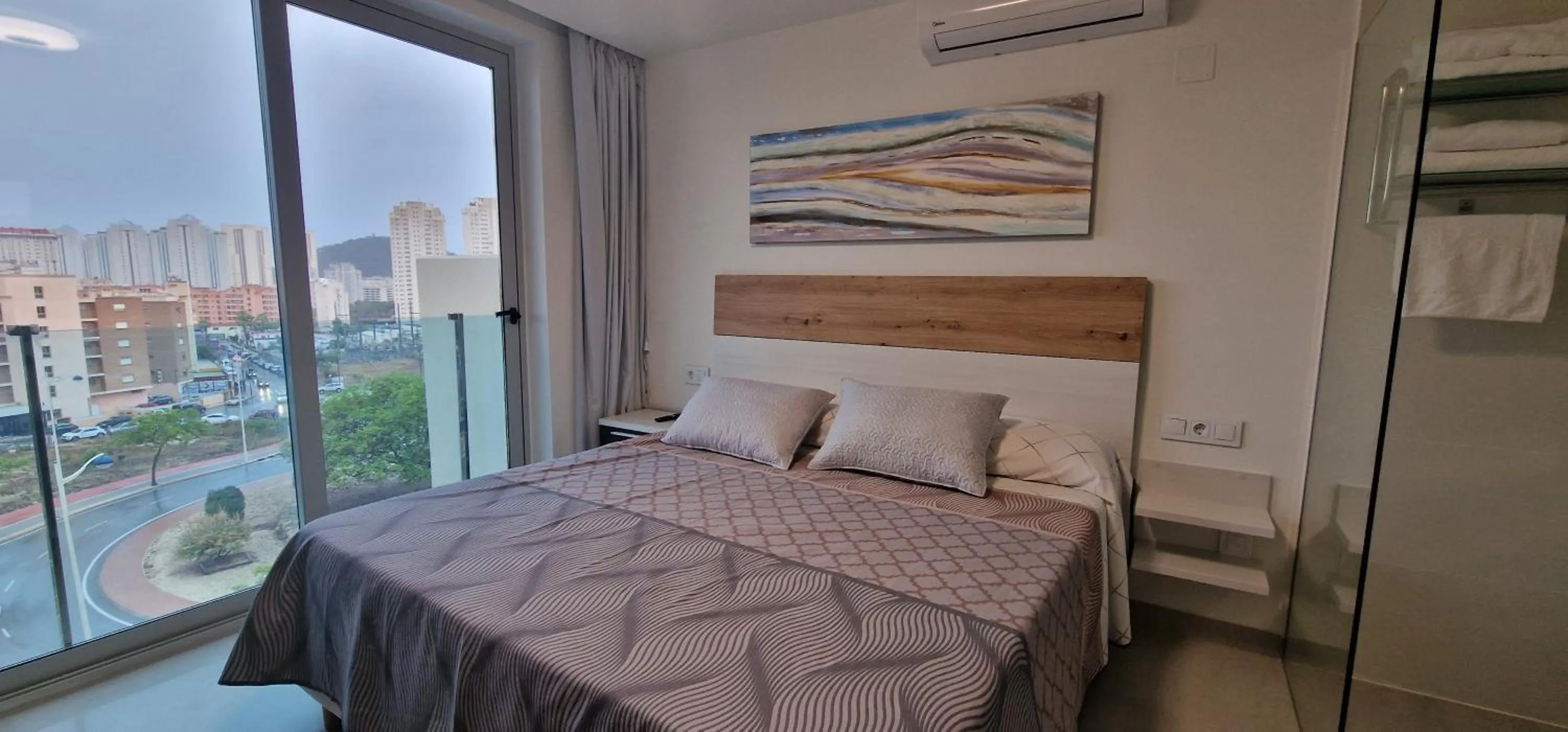 Bed in APARTAMENTOS OASIS DE LA CALA