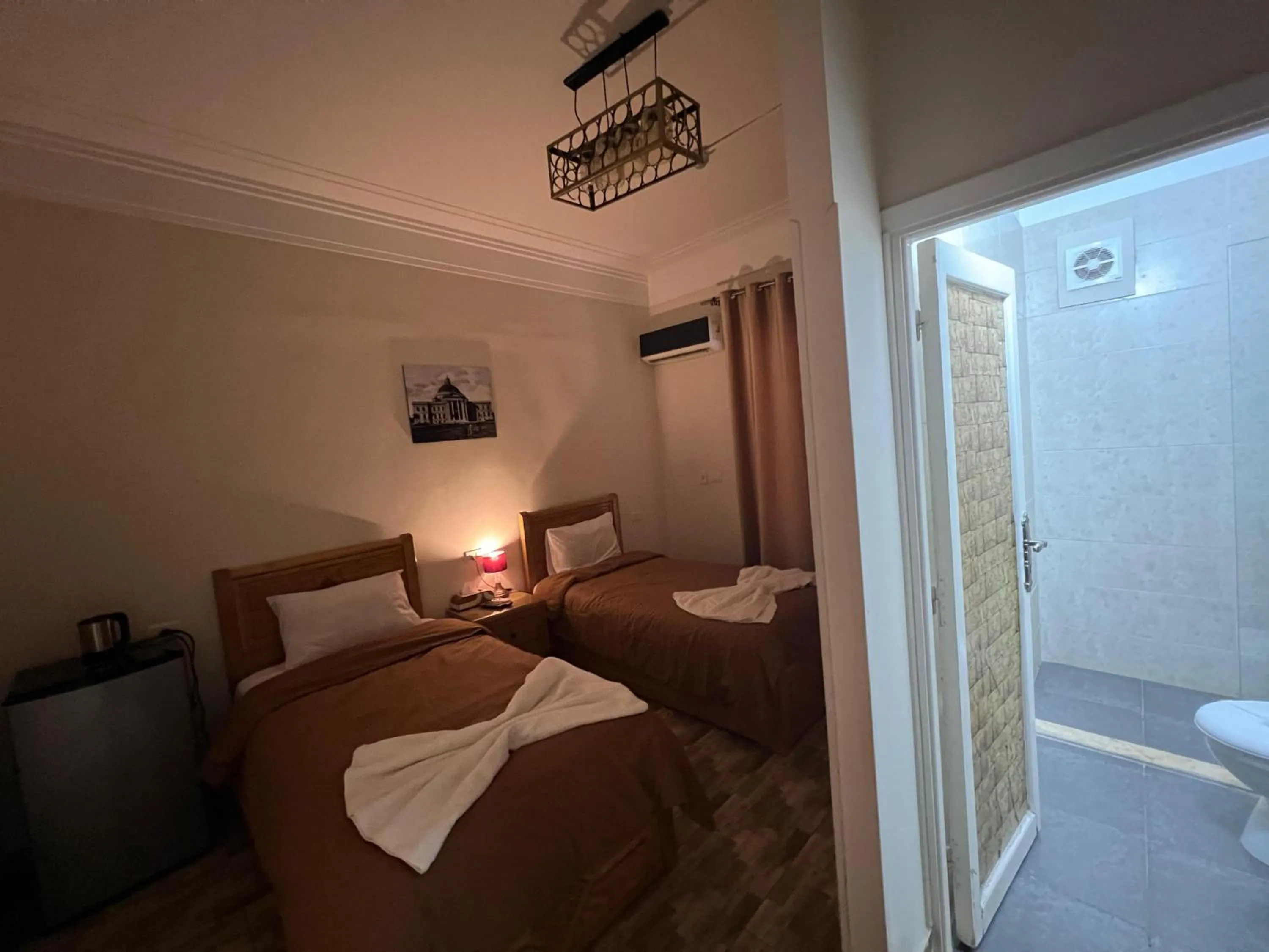 Photo of the whole room, Bed in Central Cairo Hotel