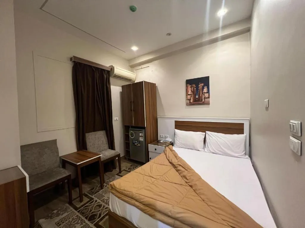 Bed in Central Cairo Hotel