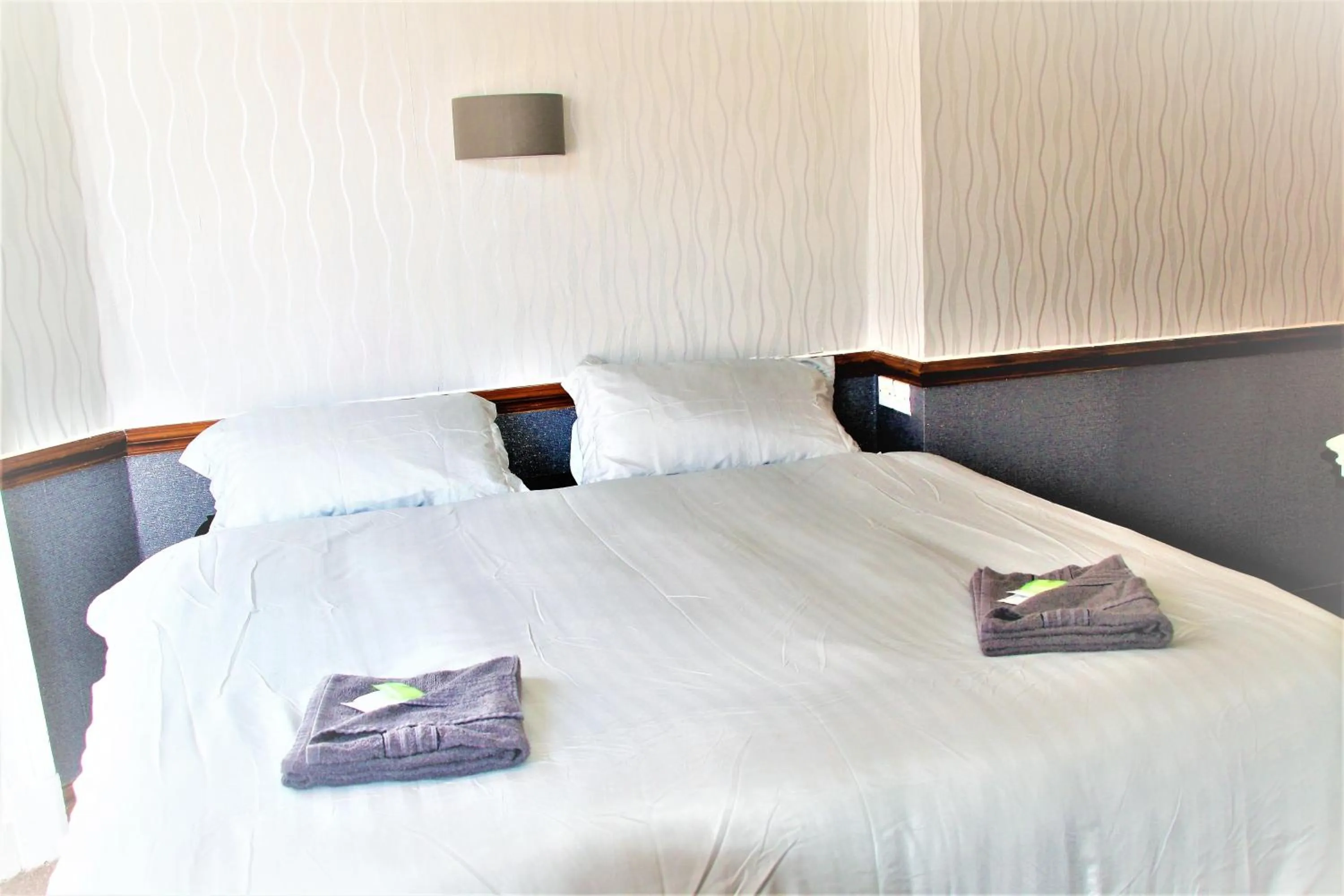 Bed in Pine Lodge Hotel