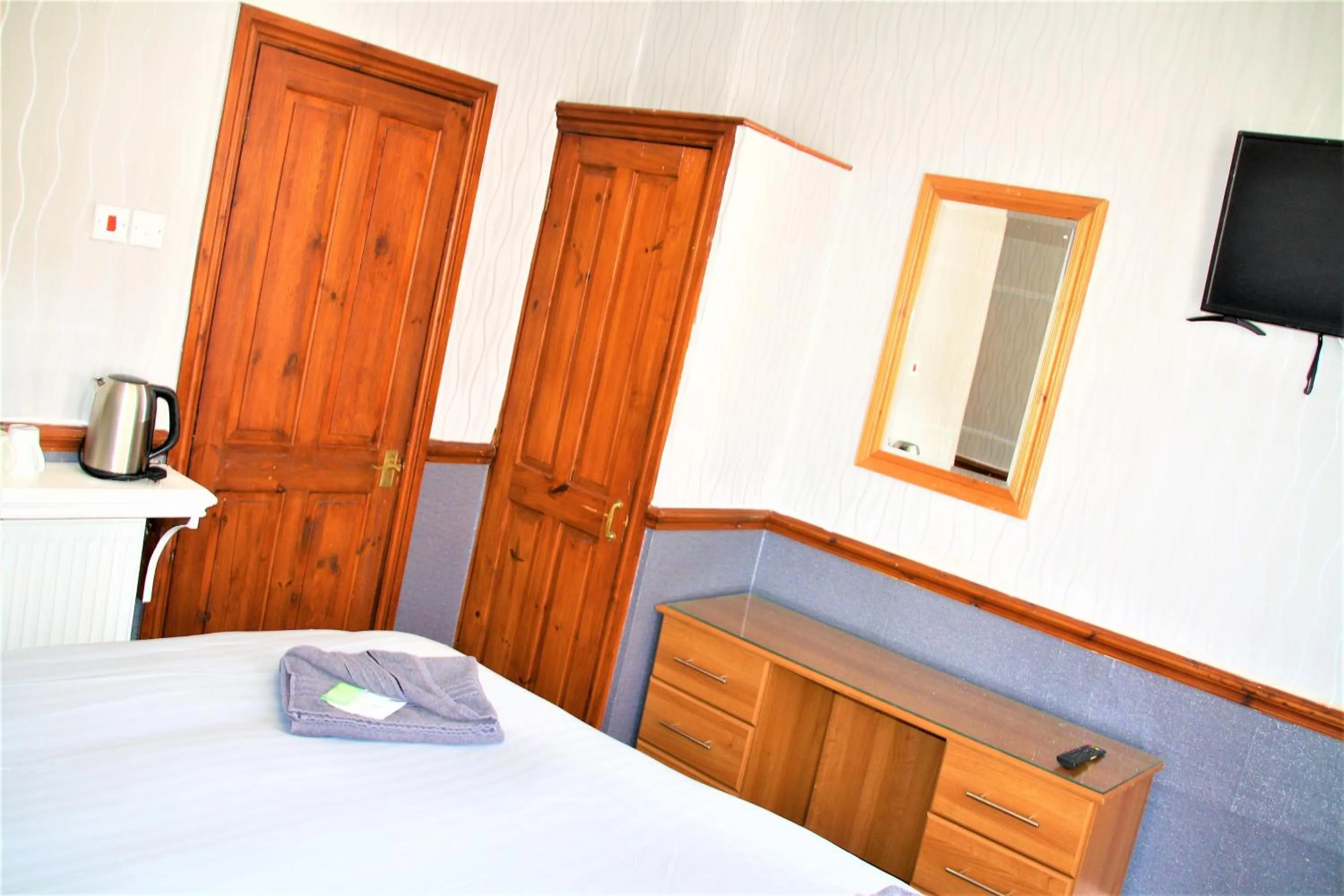 Bed in Pine Lodge Hotel