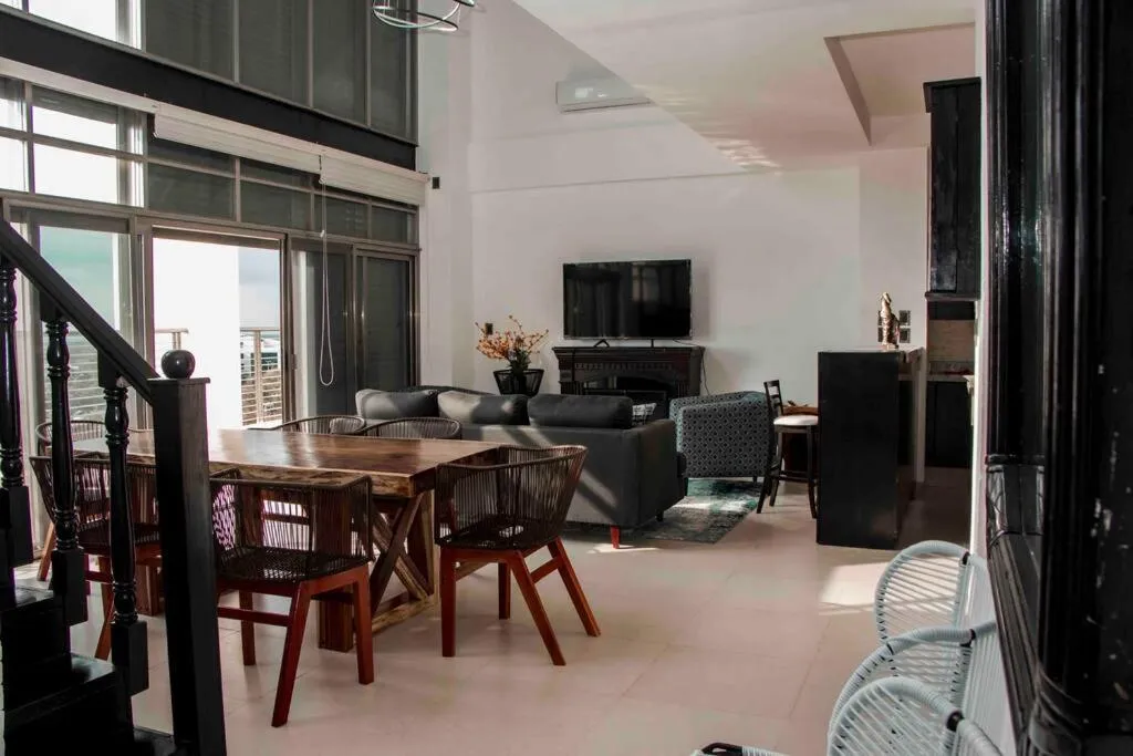 Communal lounge/ TV room in Hermoso Penthouse Rooftop con alberca