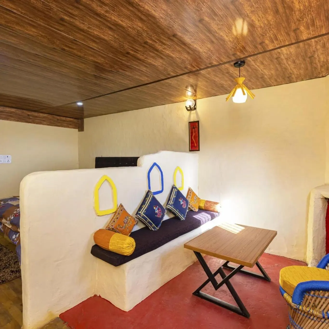 Seating area in Kana Mud An Ethnic Village Resort - Beautiful View of Gangotri Mountains