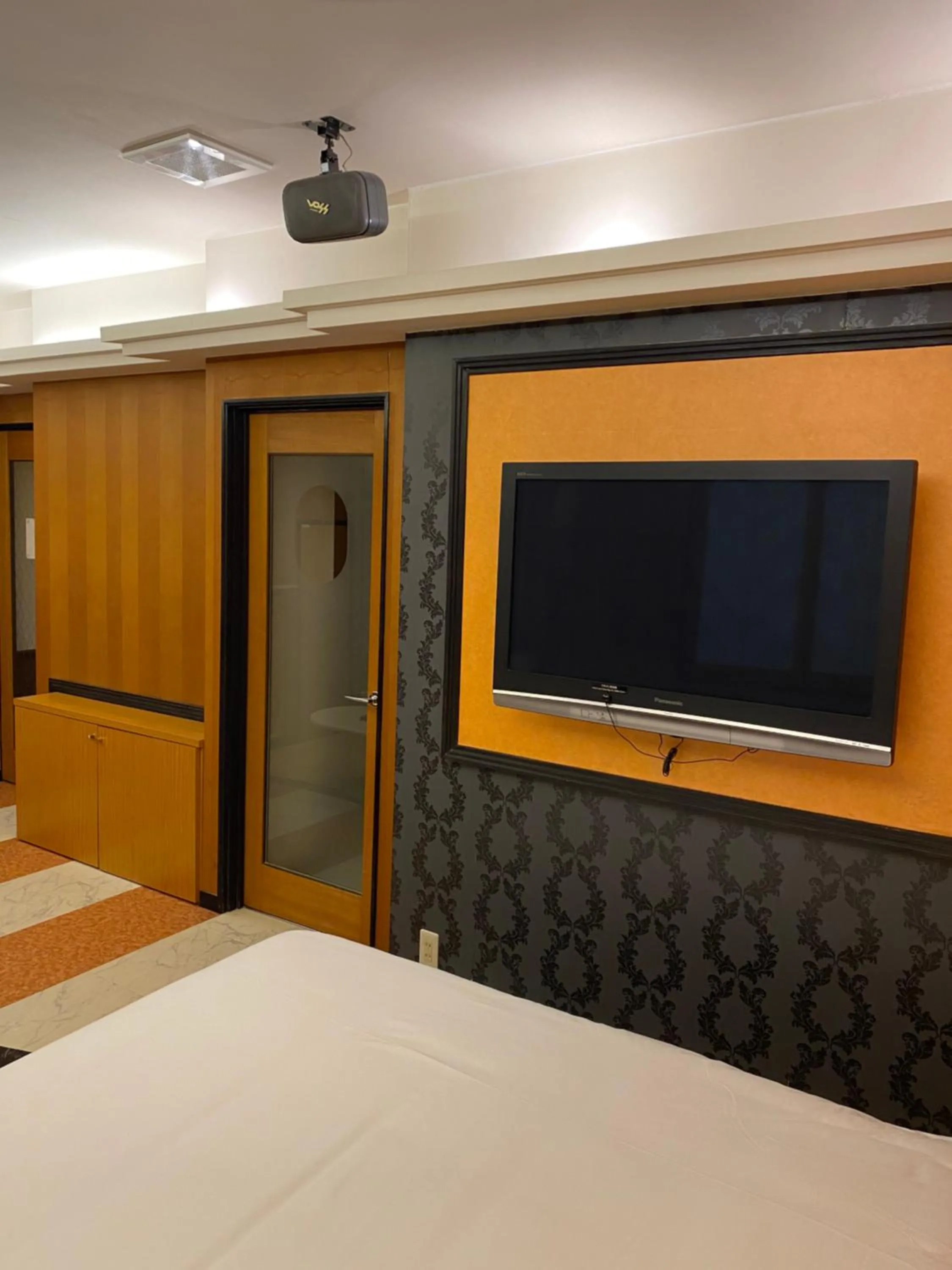 Bed in Hotel Takao Asile