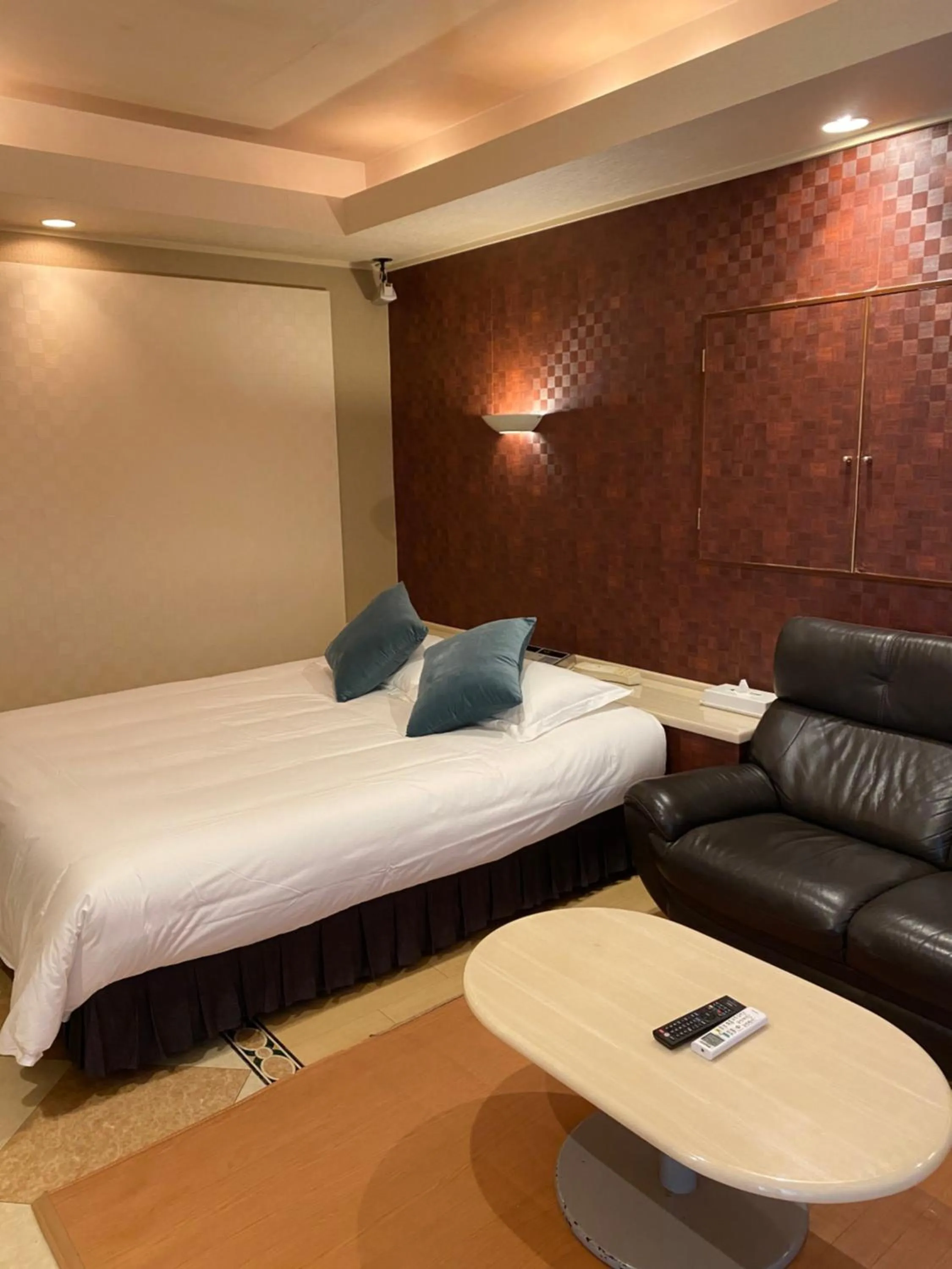 Bed in Hotel Takao Asile