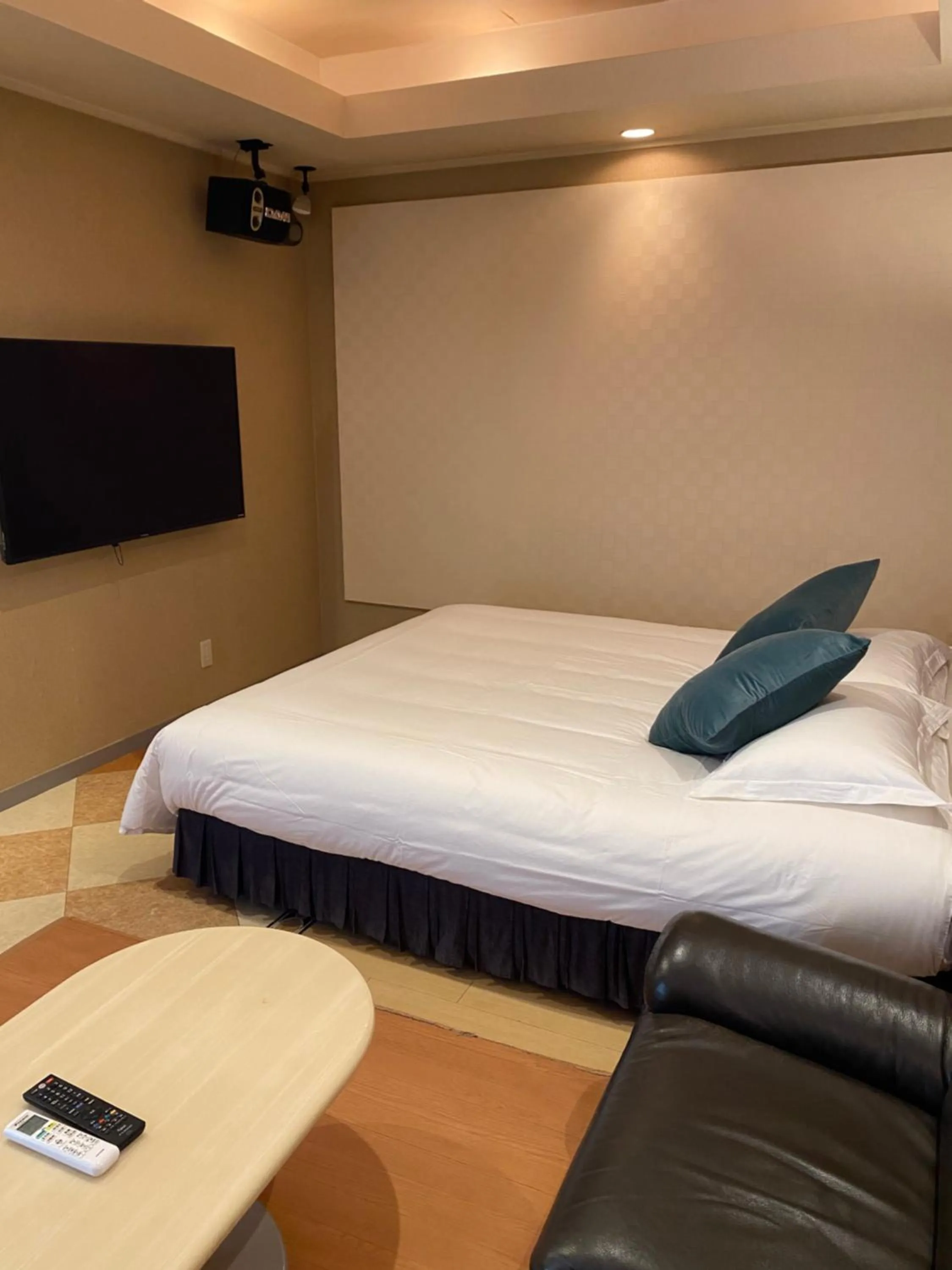 Bed in Hotel Takao Asile