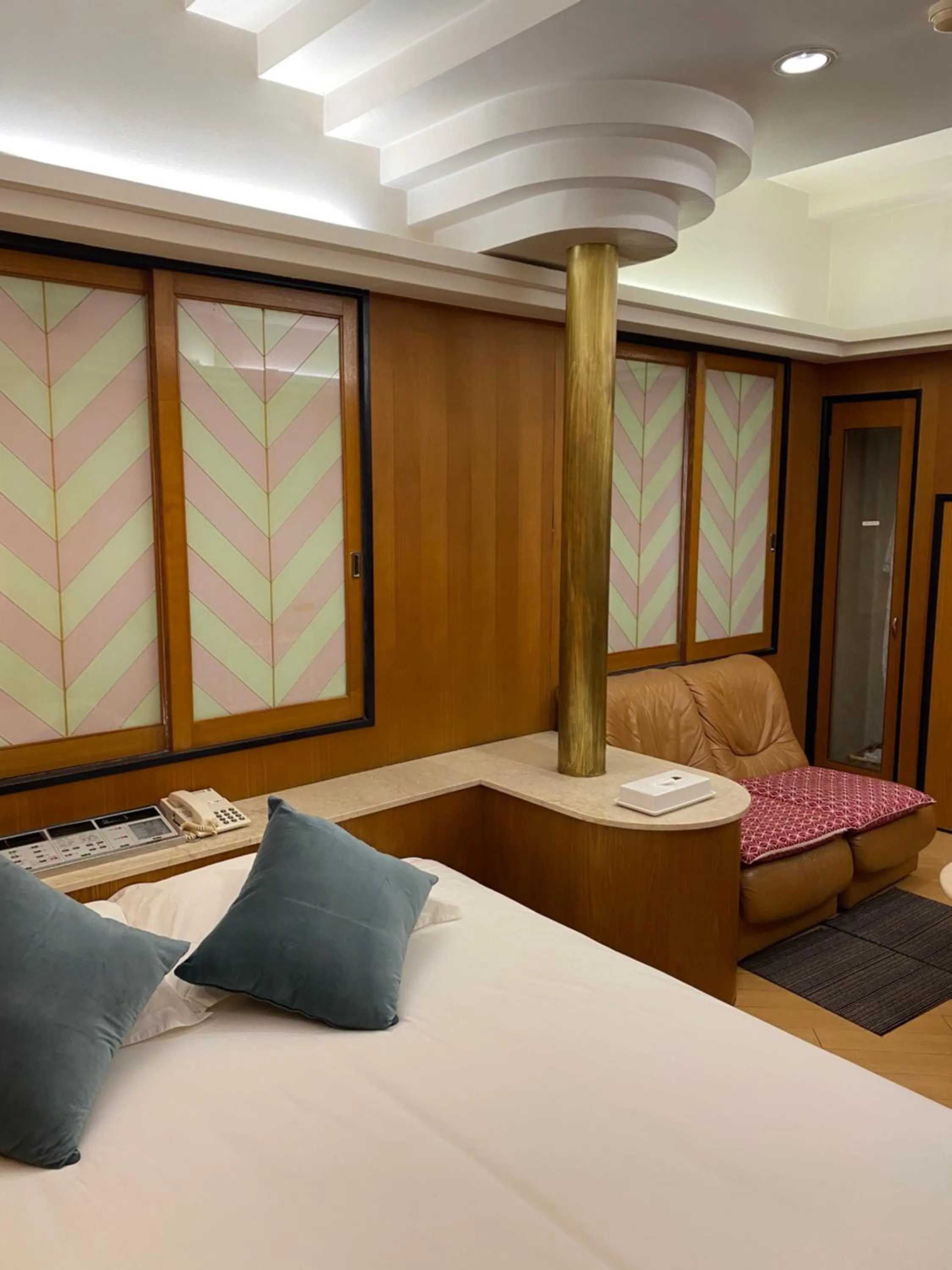 Bed in Hotel Takao Asile