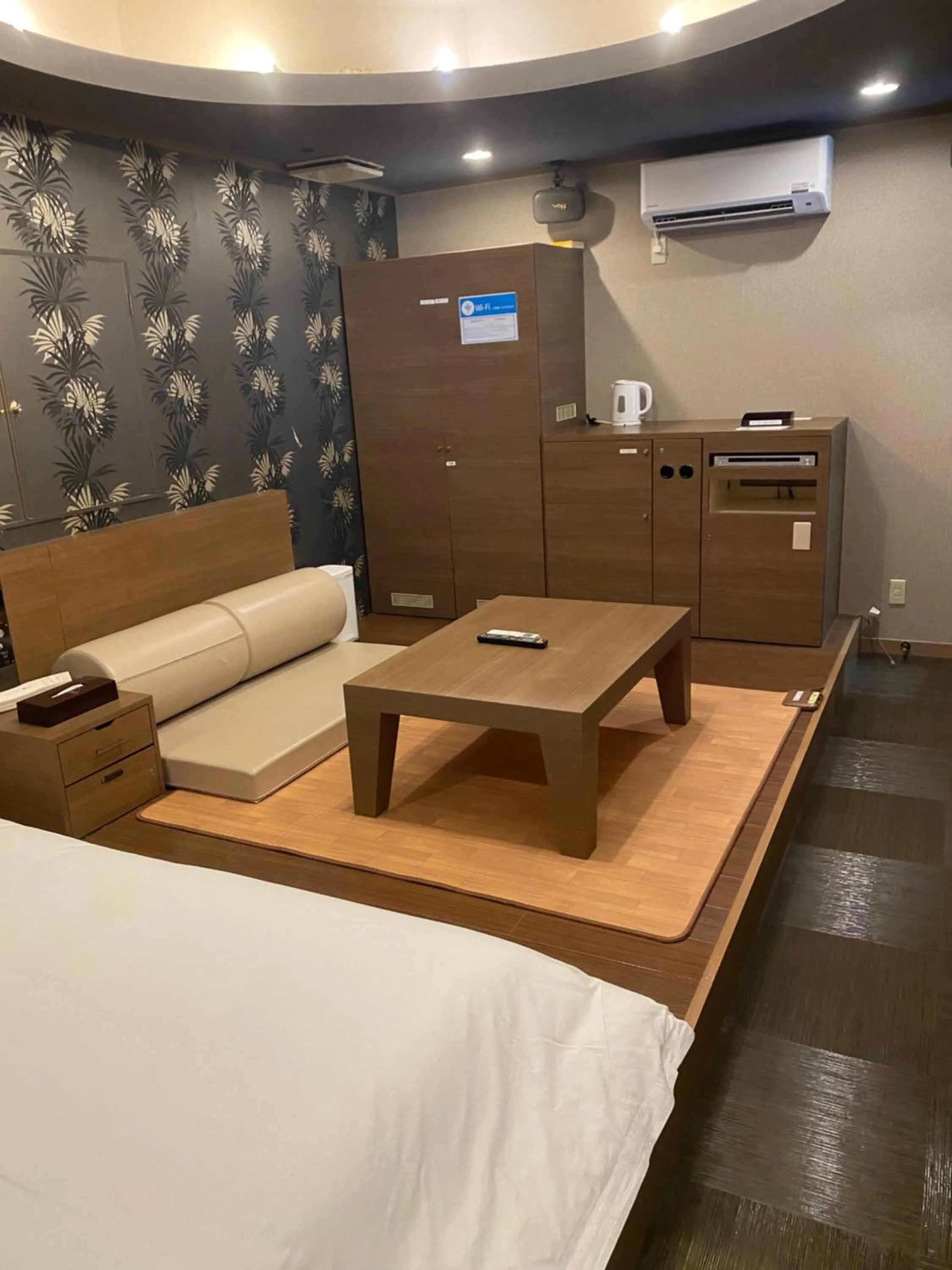 Bed in Hotel Takao Asile