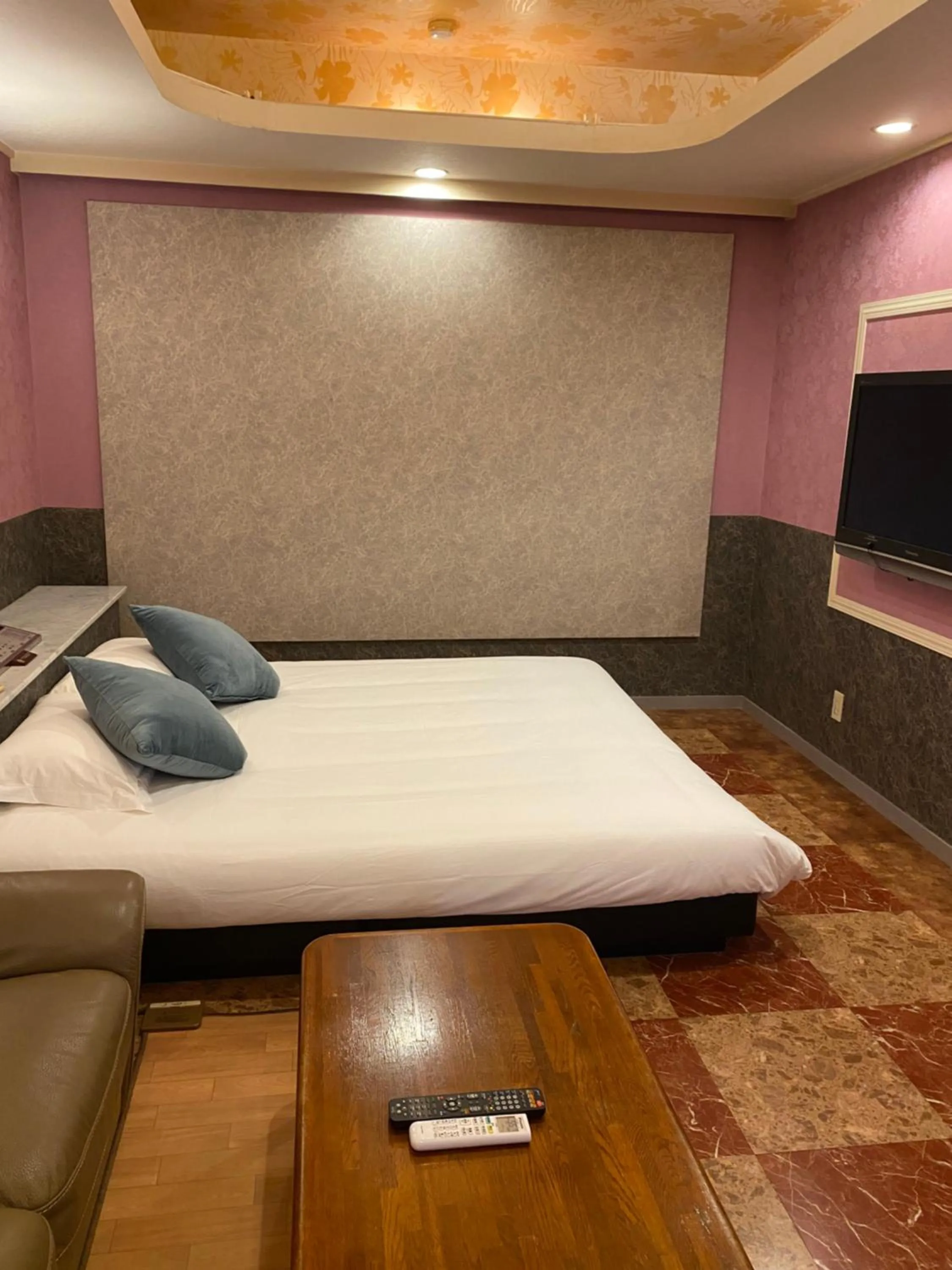 Bed in Hotel Takao Asile