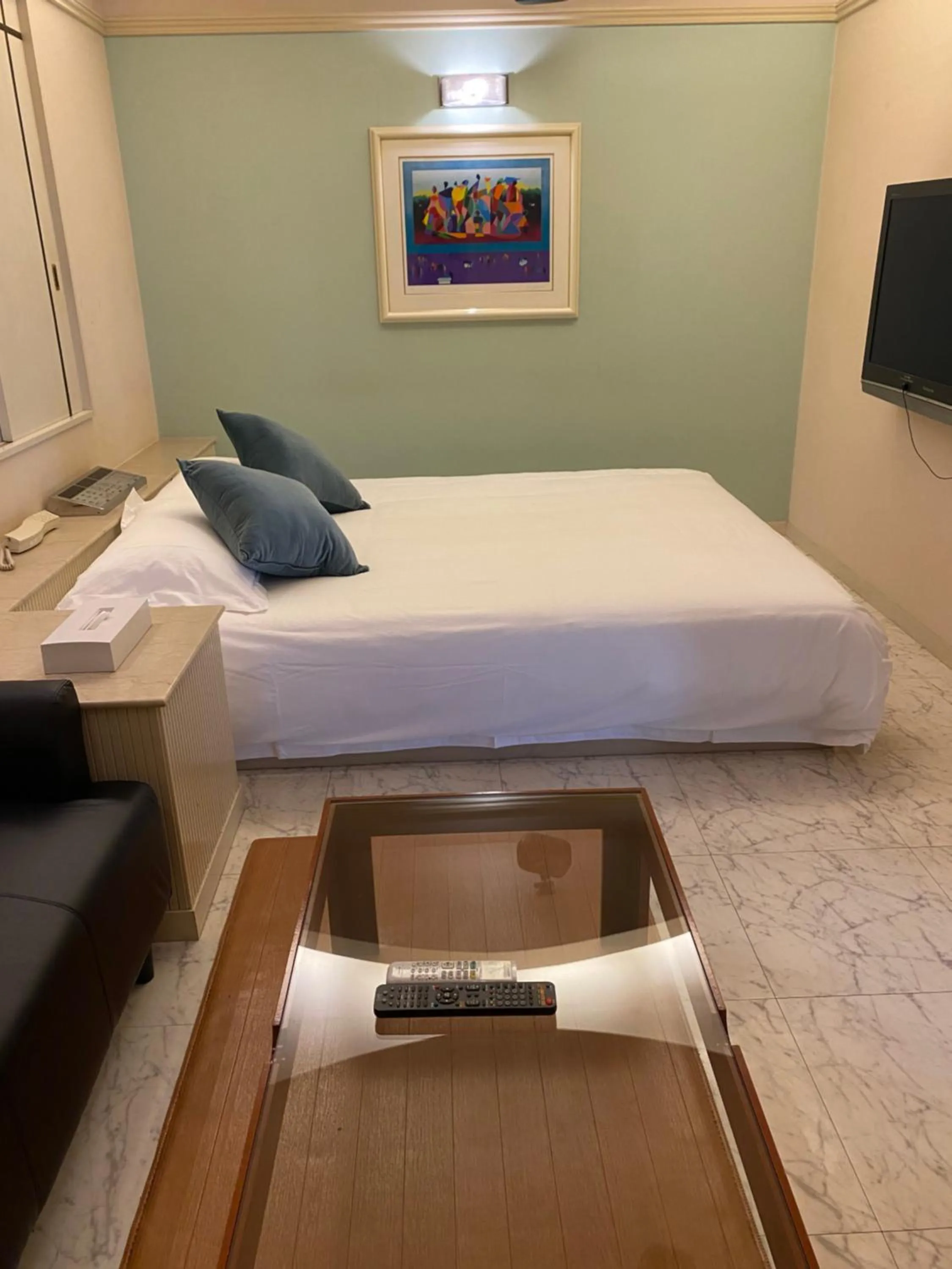 Bed in Hotel Takao Asile