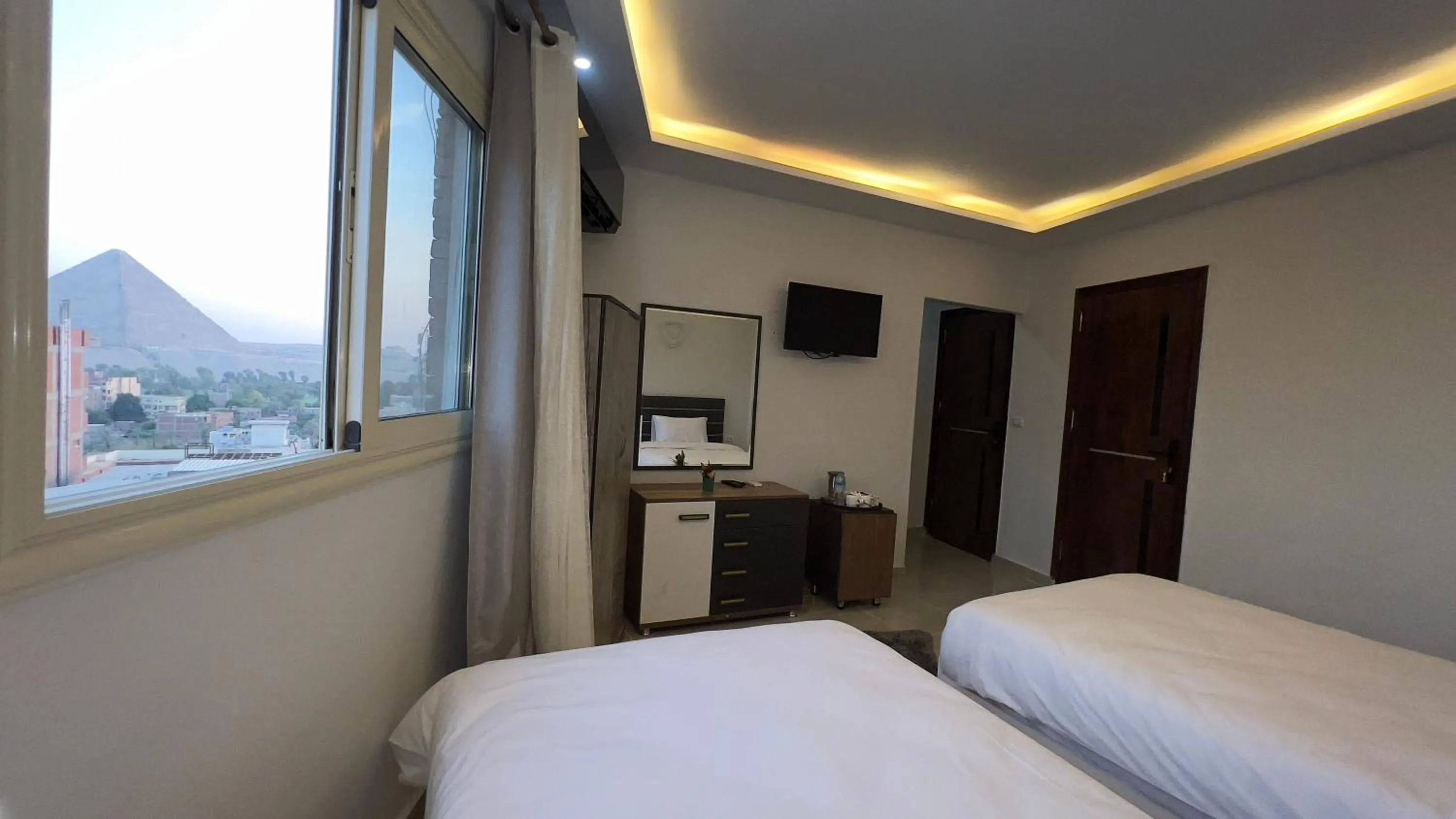 Bed in pyramids tower view inn