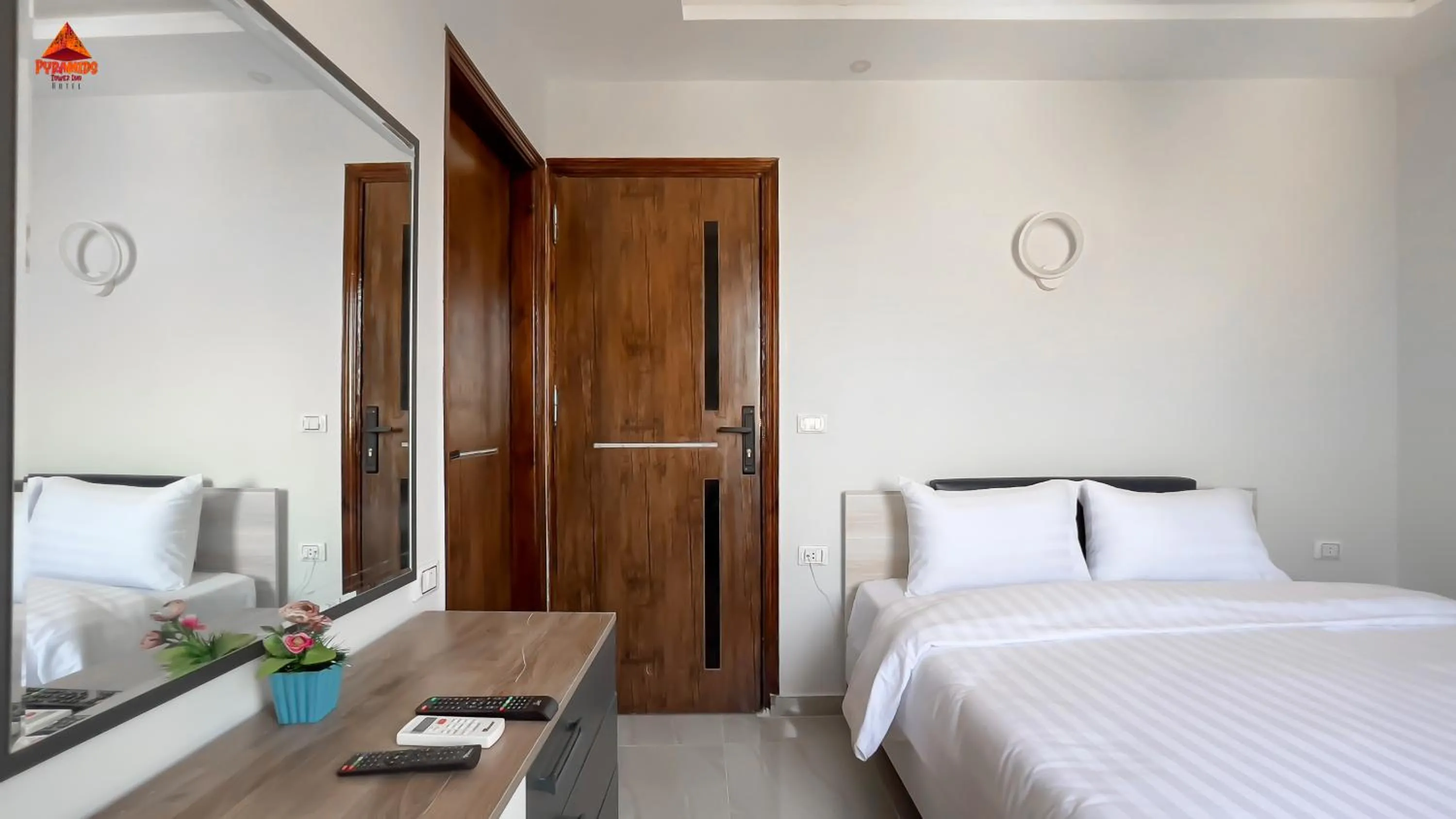 Bed in pyramids tower view inn