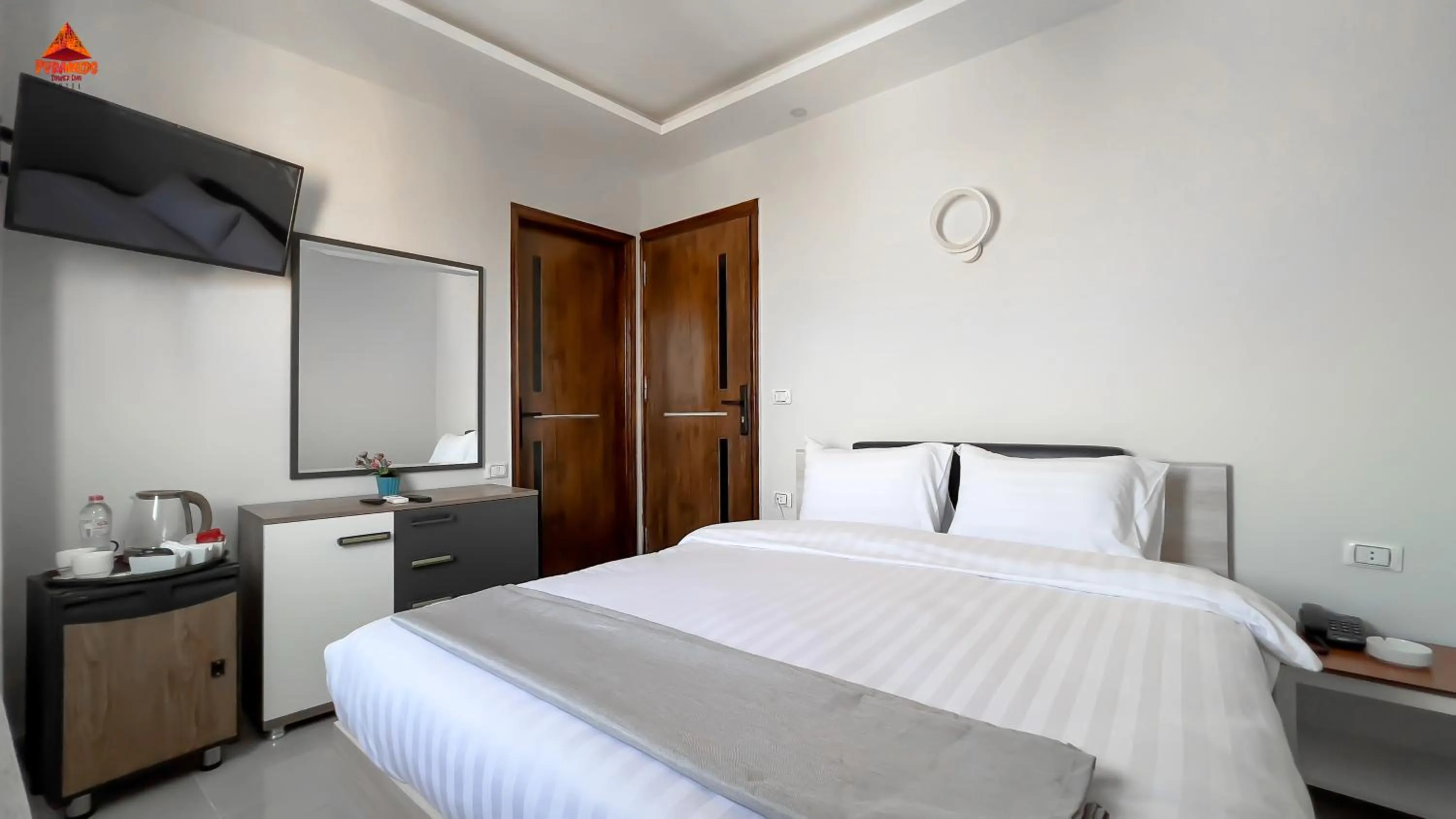 Bed in pyramids tower view inn