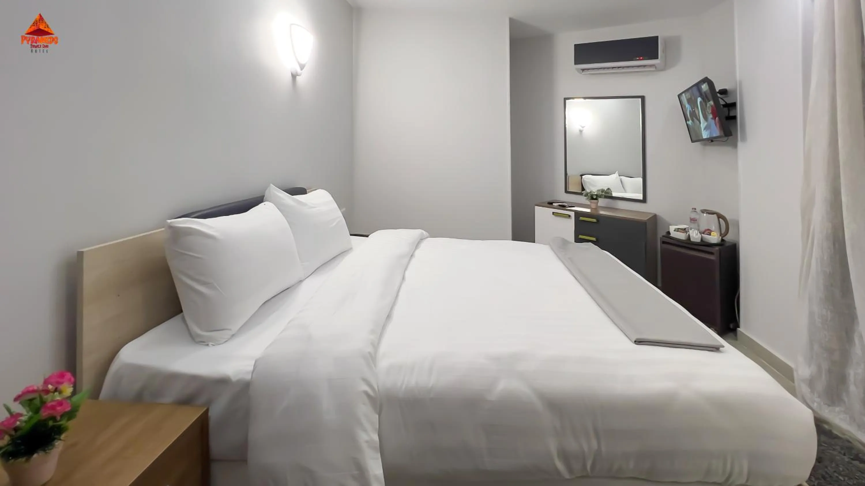 Bed in pyramids tower view inn