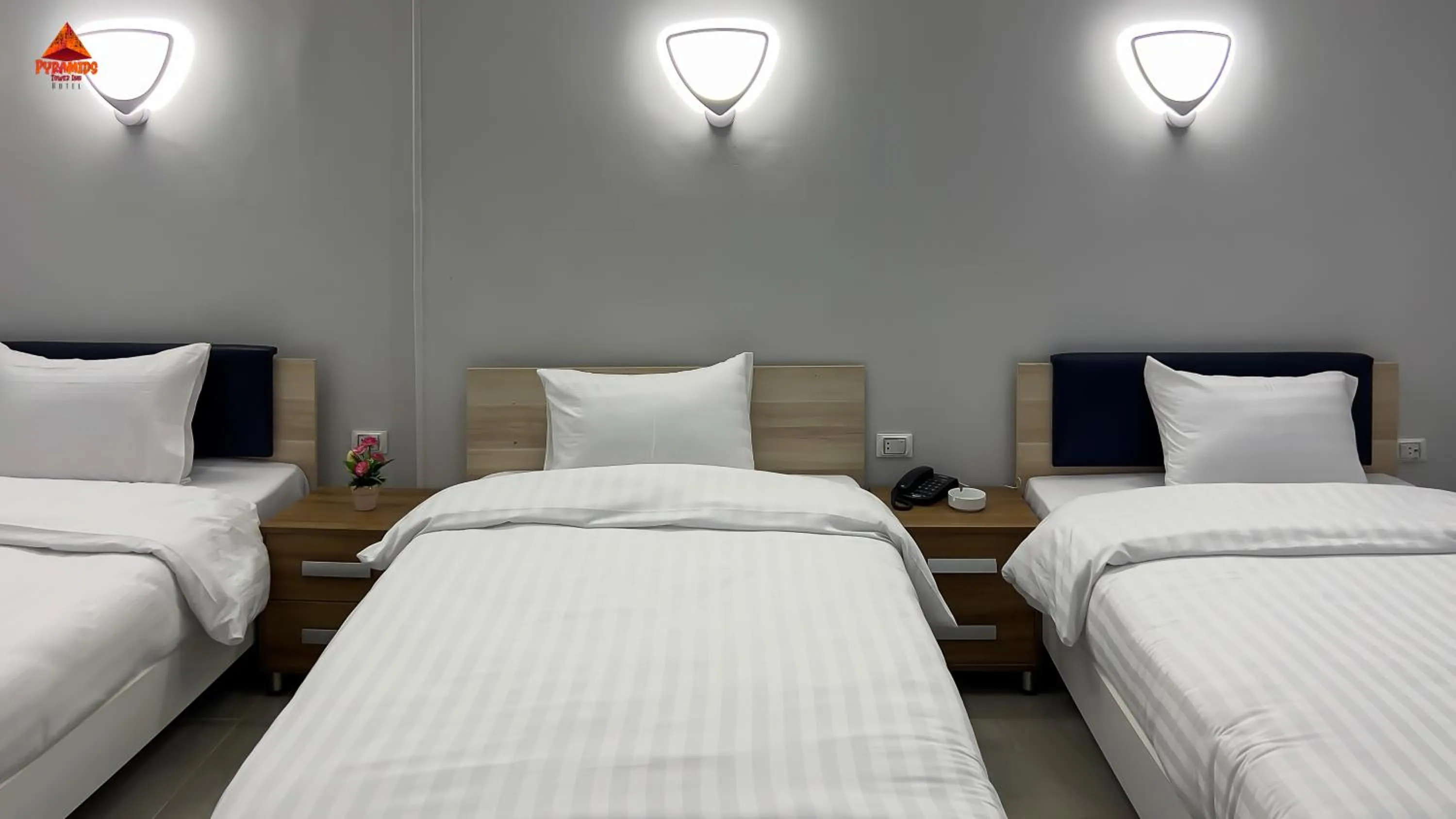 Bed in pyramids tower view inn