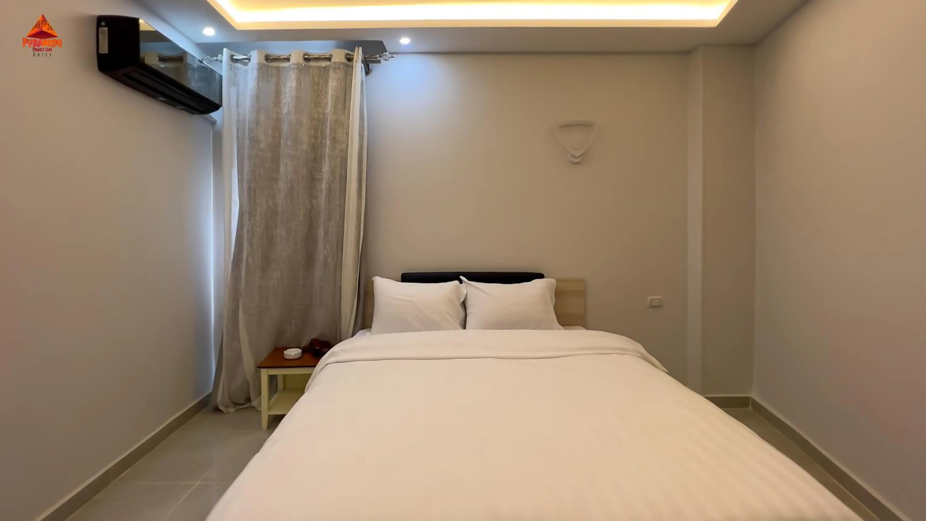 Bed in pyramids tower view inn