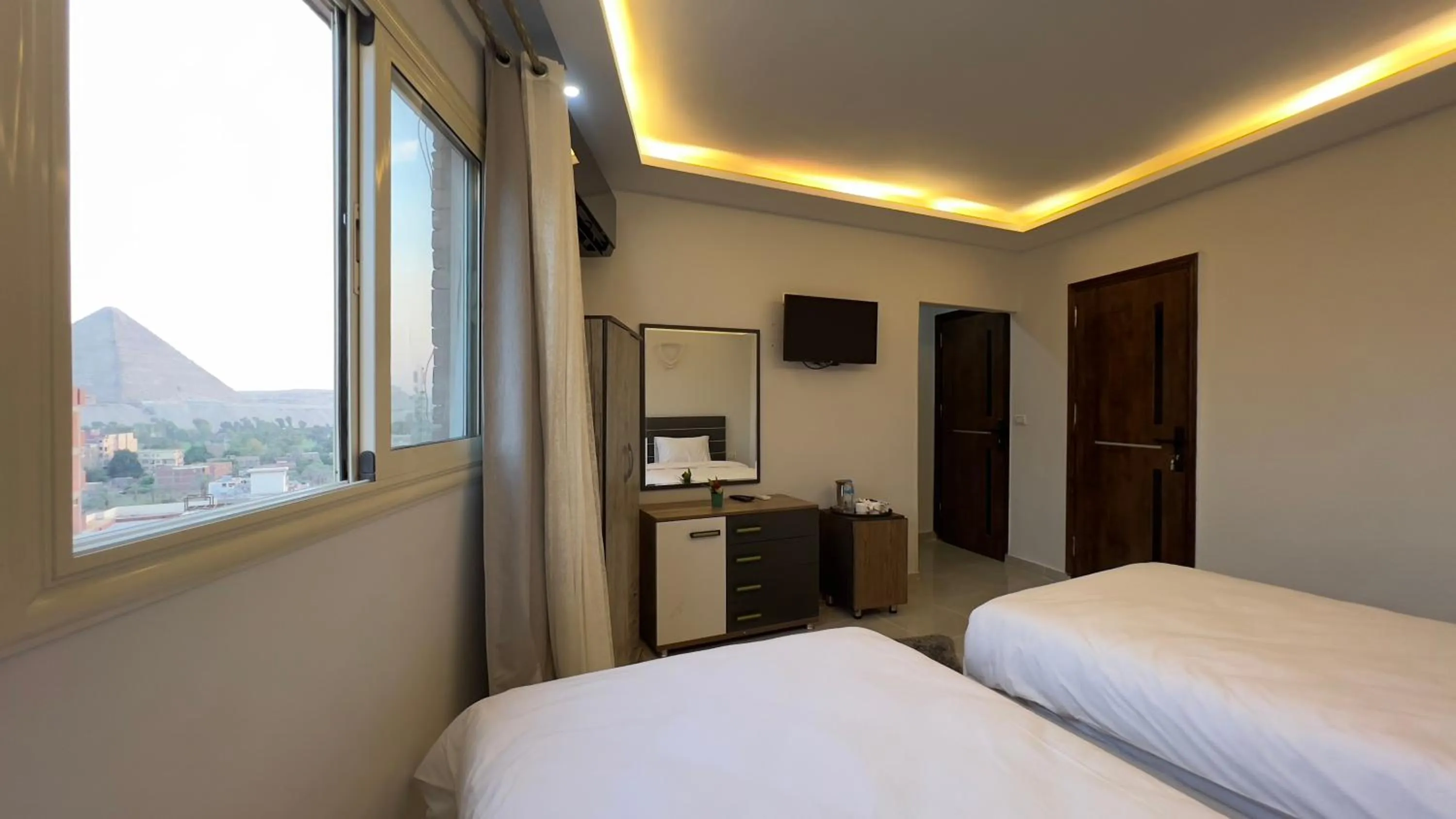 Bed in pyramids tower view inn