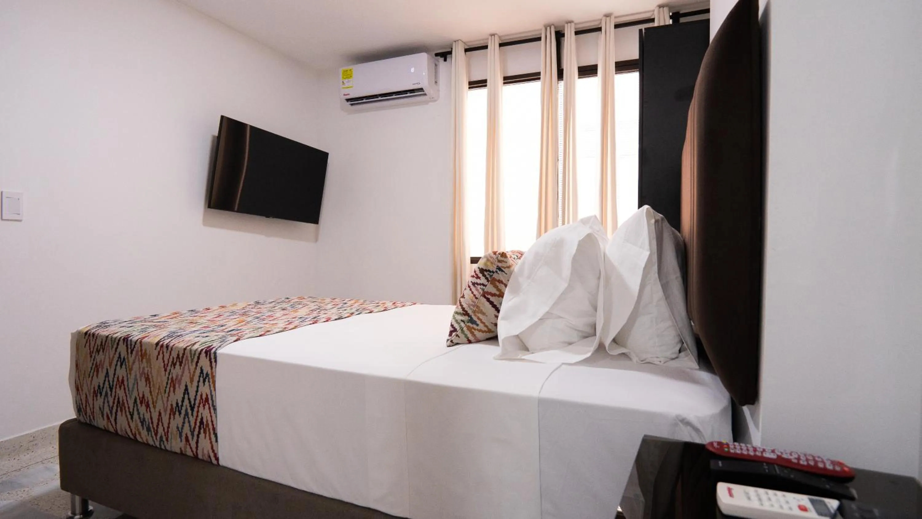 TV and multimedia, Bed in Hotel Arisha Cali