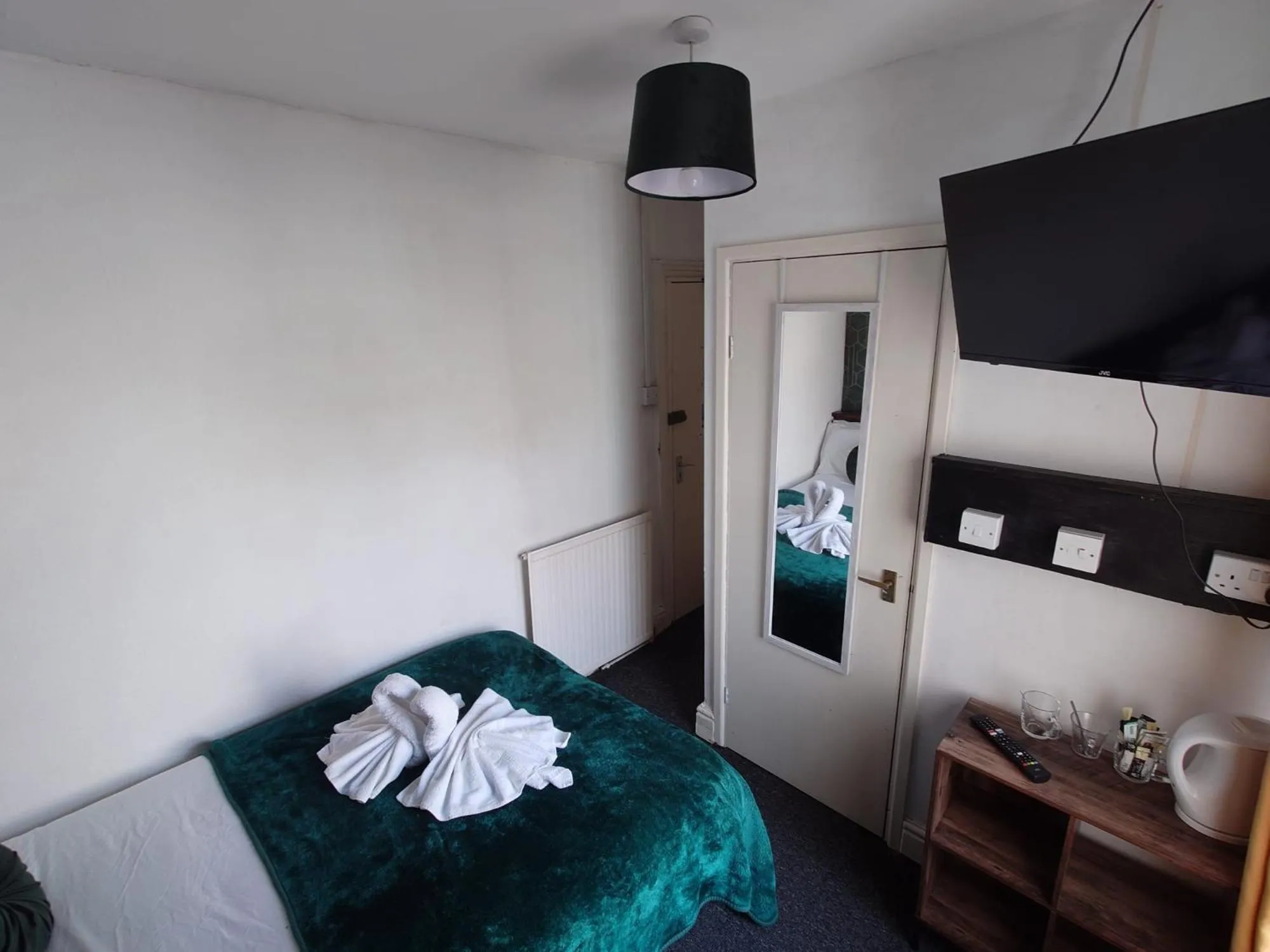 Bed in Harriette's Guest House