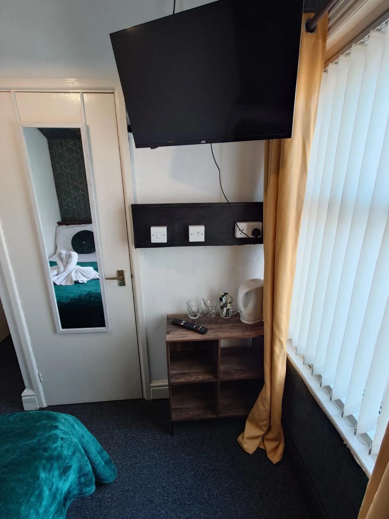 Bed in Harriette's Guest House