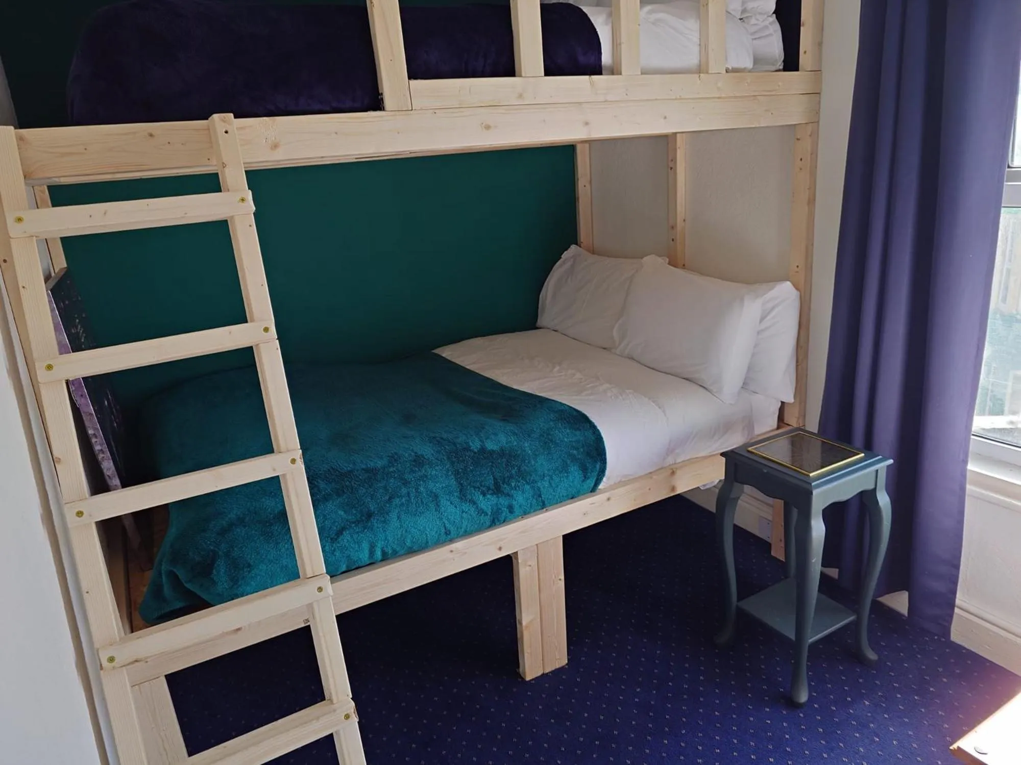 Bed in Harriette's Guest House