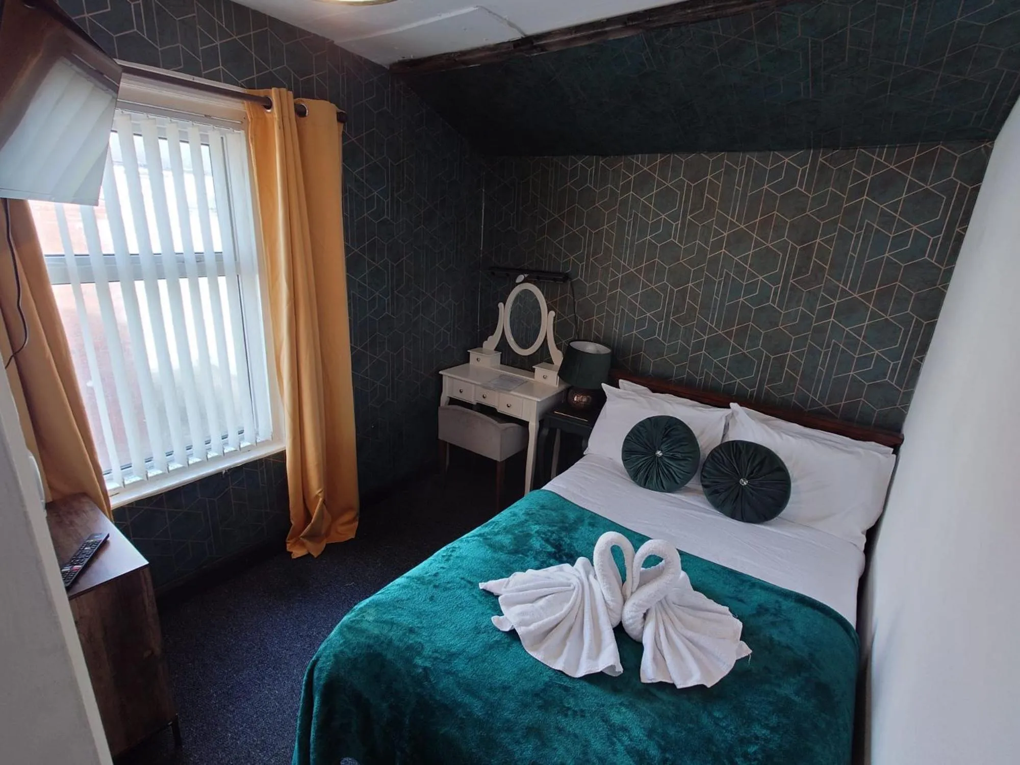 Bed in Harriette's Guest House