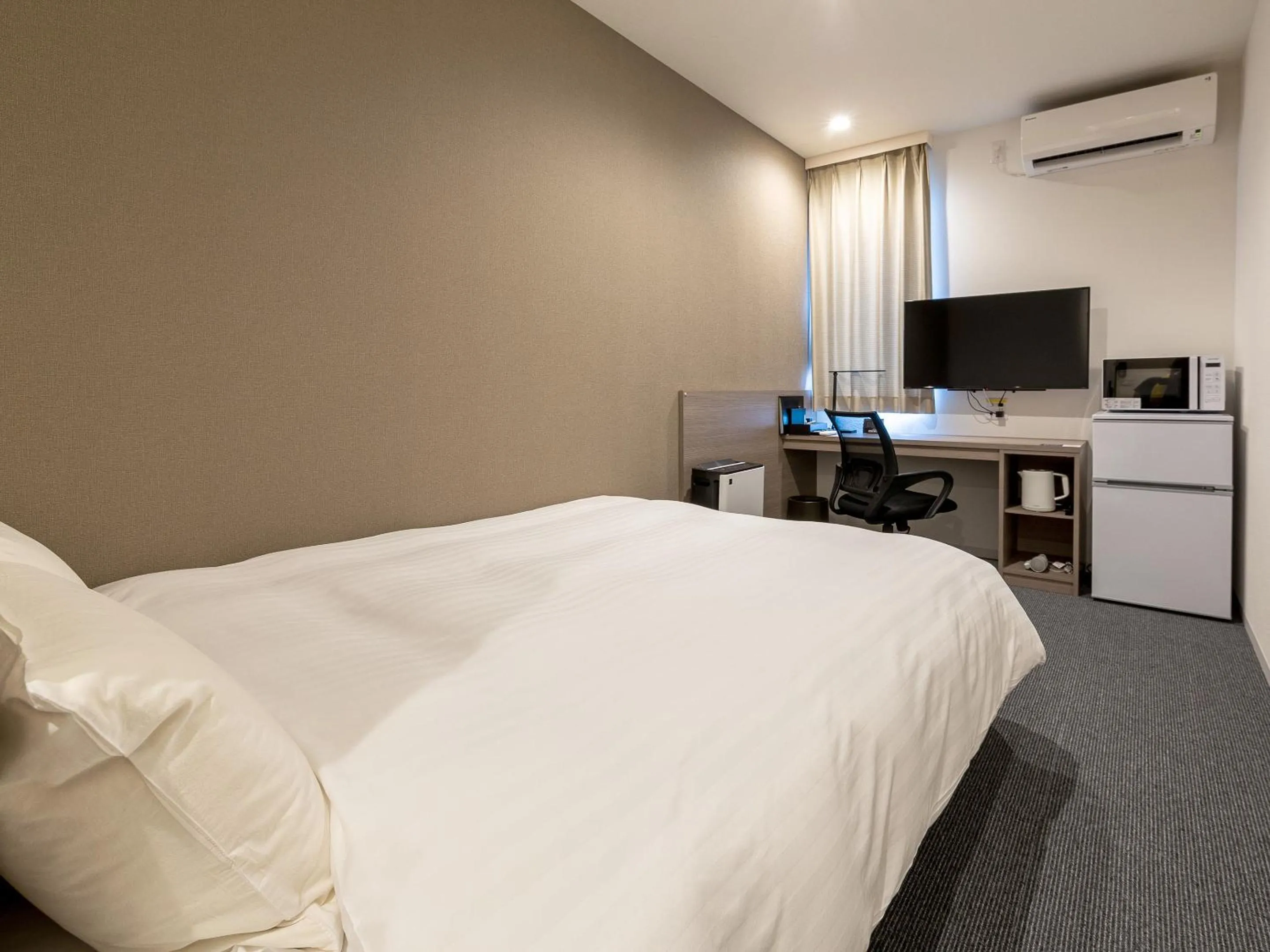 Photo of the whole room, Bed in HOTEL R9 The Yard Kanoya