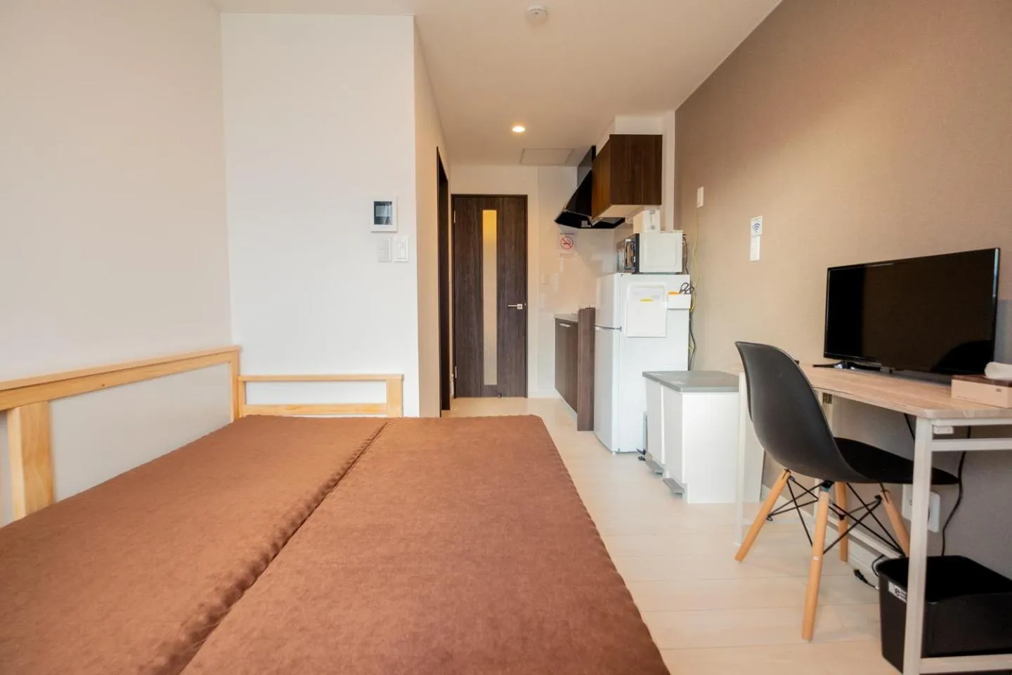 Communal lounge/ TV room, Bed in Niseko Hirafu Ski Resort Condo