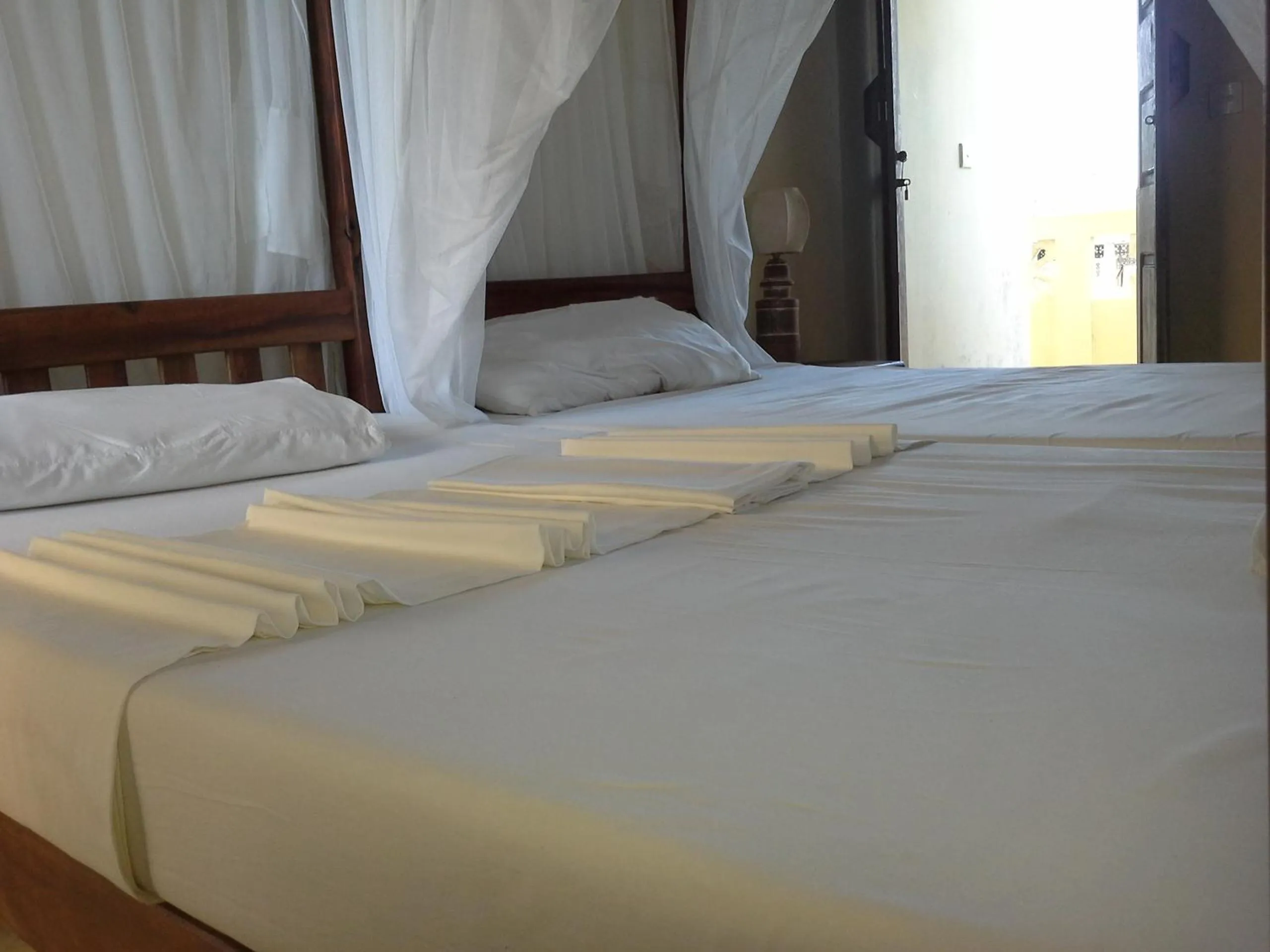 Bed in Msafini Hotel