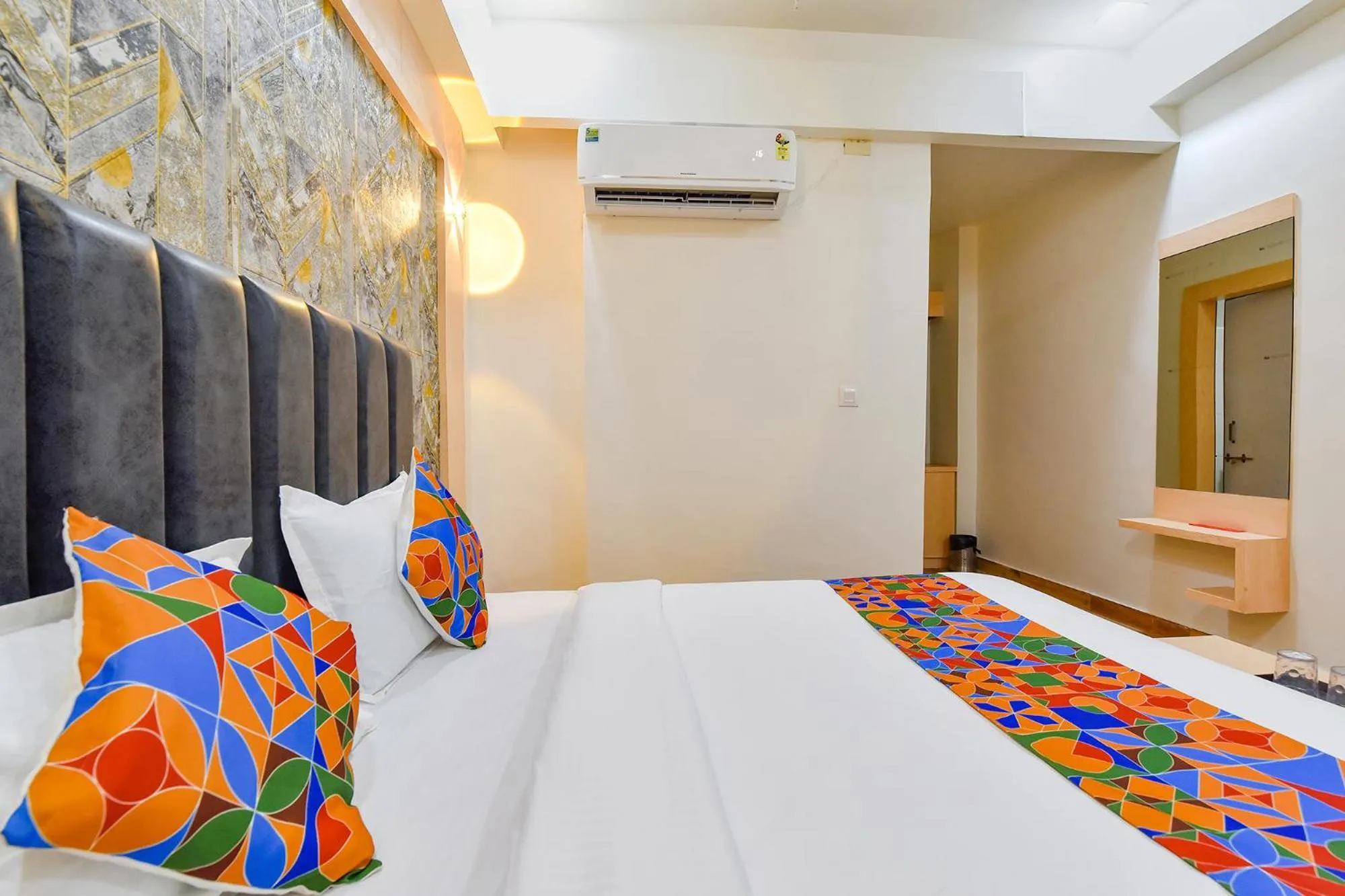 Bed in FabHotel Symphony Grand - Inside Barcelona Complex