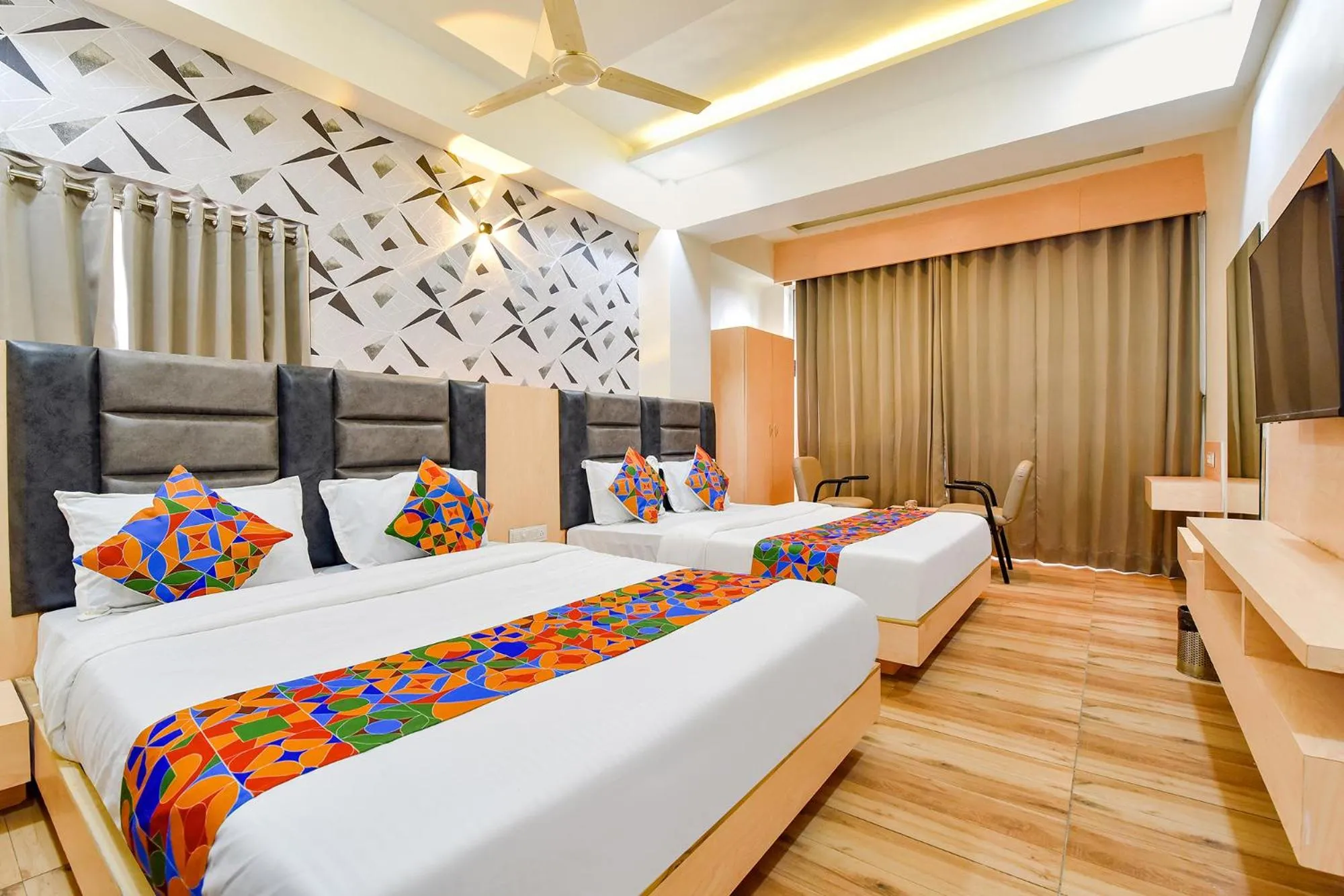 Bed in FabHotel Symphony Grand - Inside Barcelona Complex