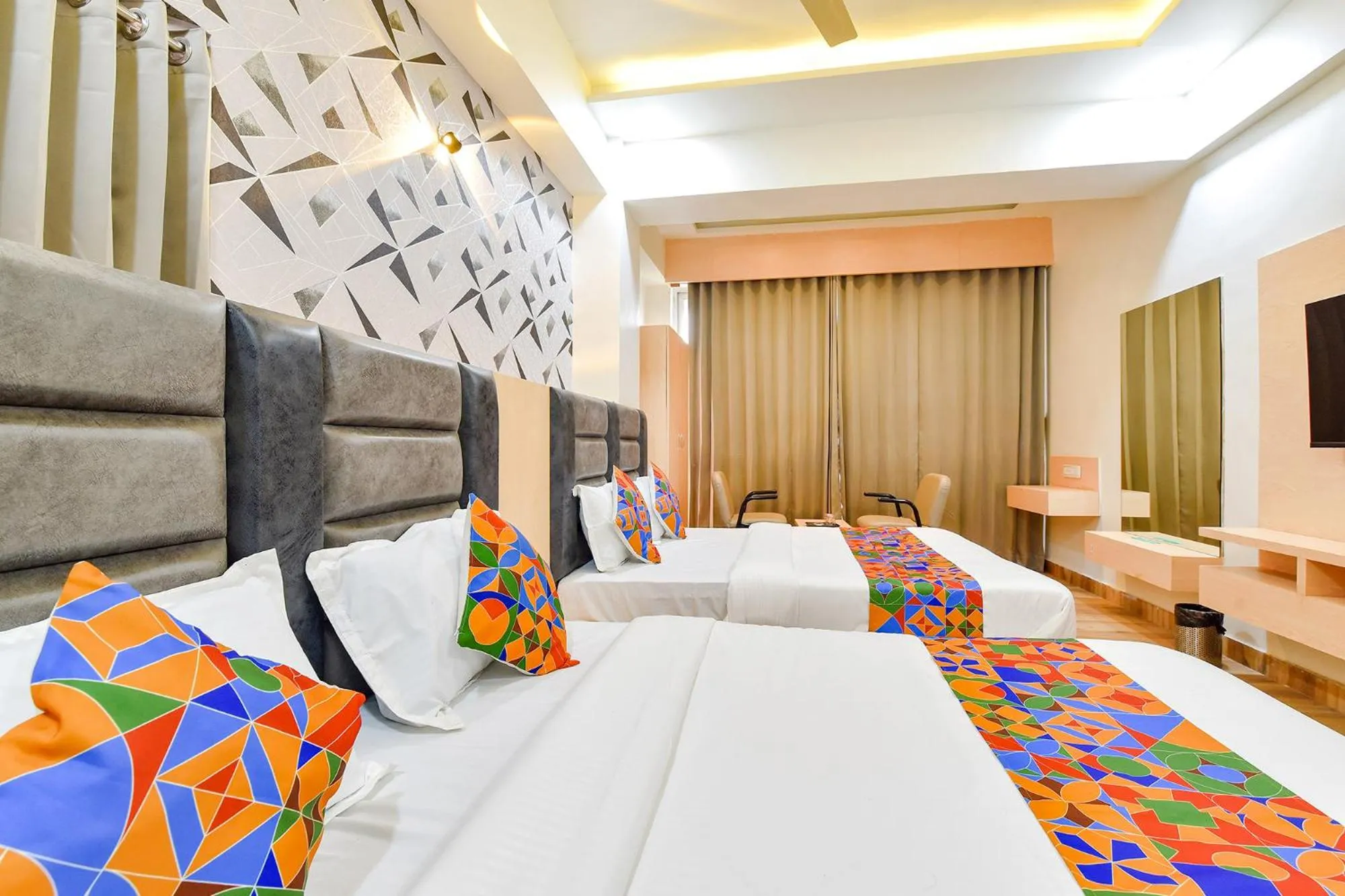 Bed in FabHotel Symphony Grand - Inside Barcelona Complex