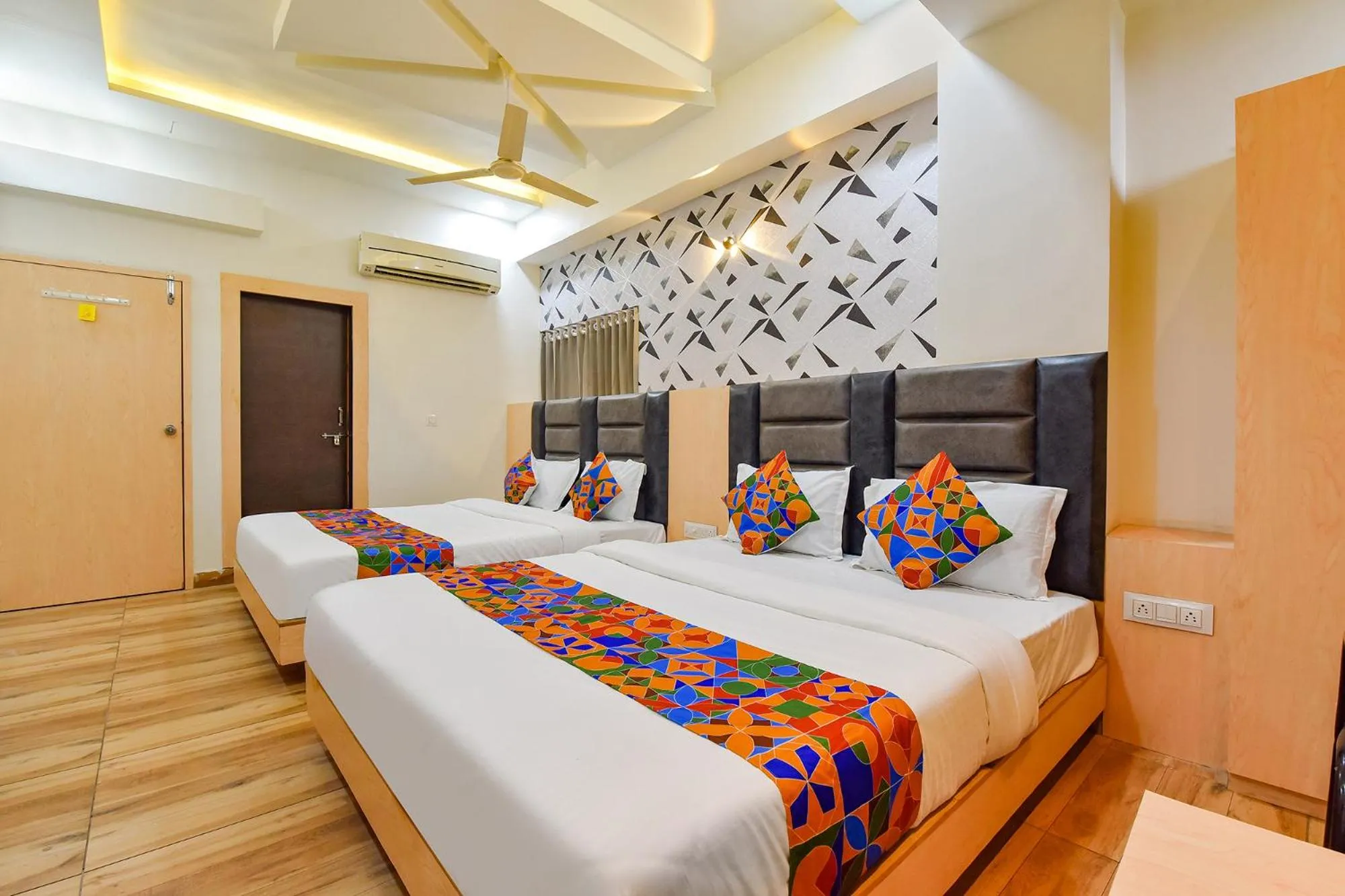 Bed in FabHotel Symphony Grand - Inside Barcelona Complex