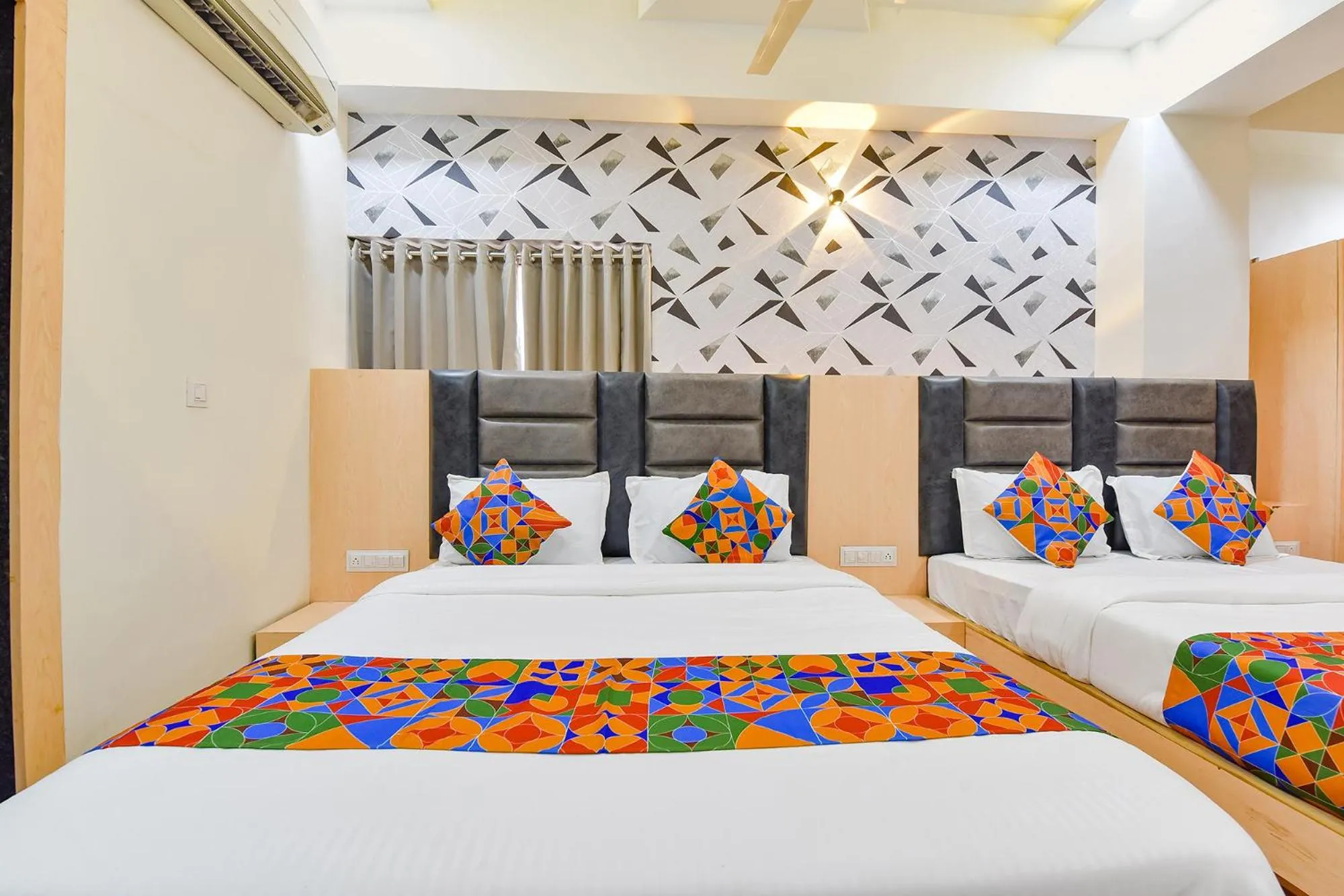 Bed in FabHotel Symphony Grand - Inside Barcelona Complex