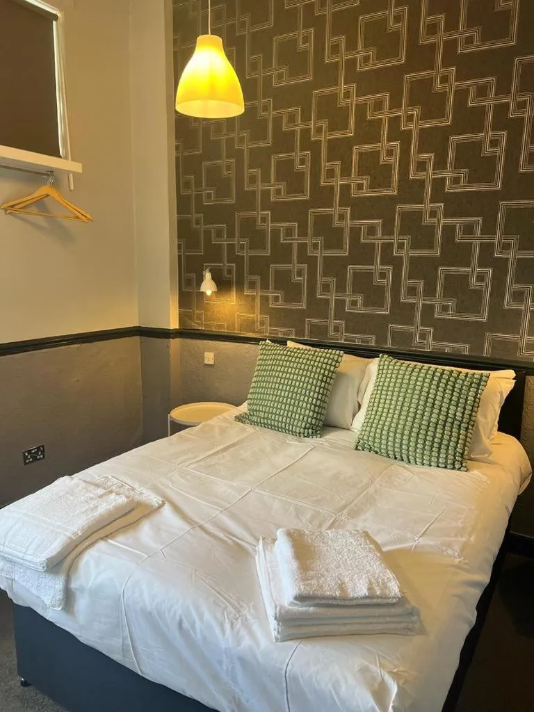 Bedroom in The Charles Dickens Hotel