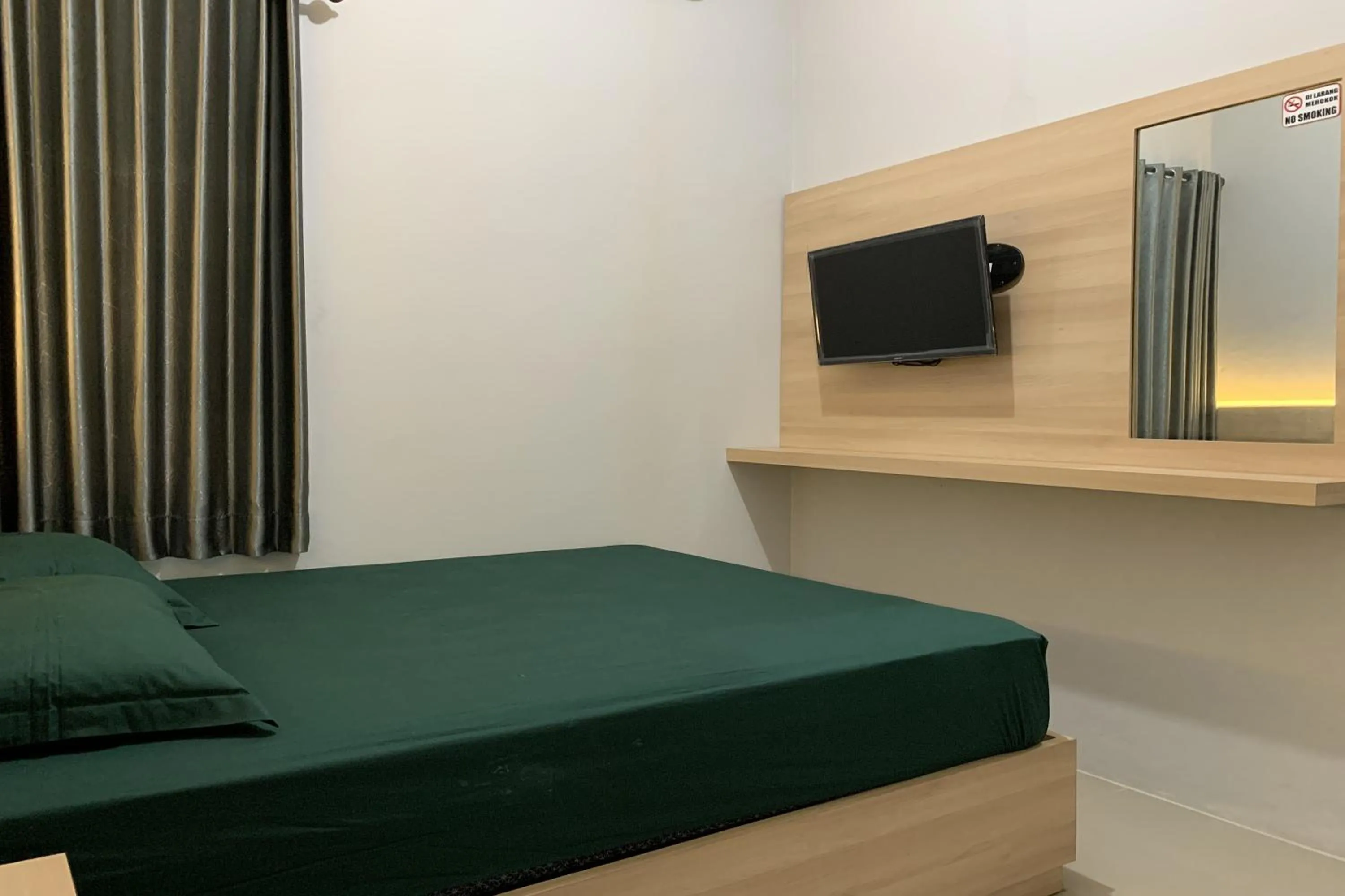 Bed in Hotel Merak Indah