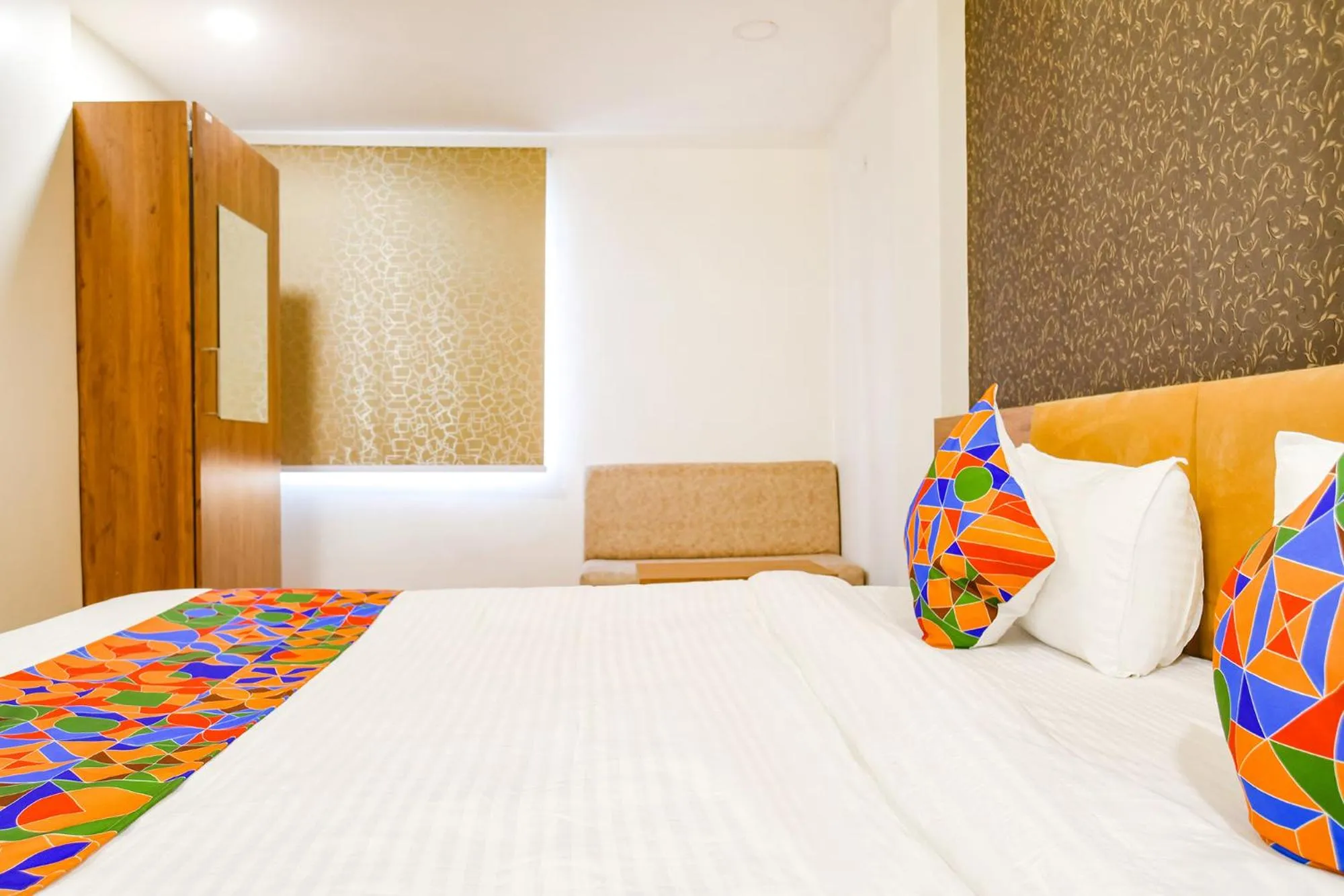 Bed in FabHotel Woodlark Inn