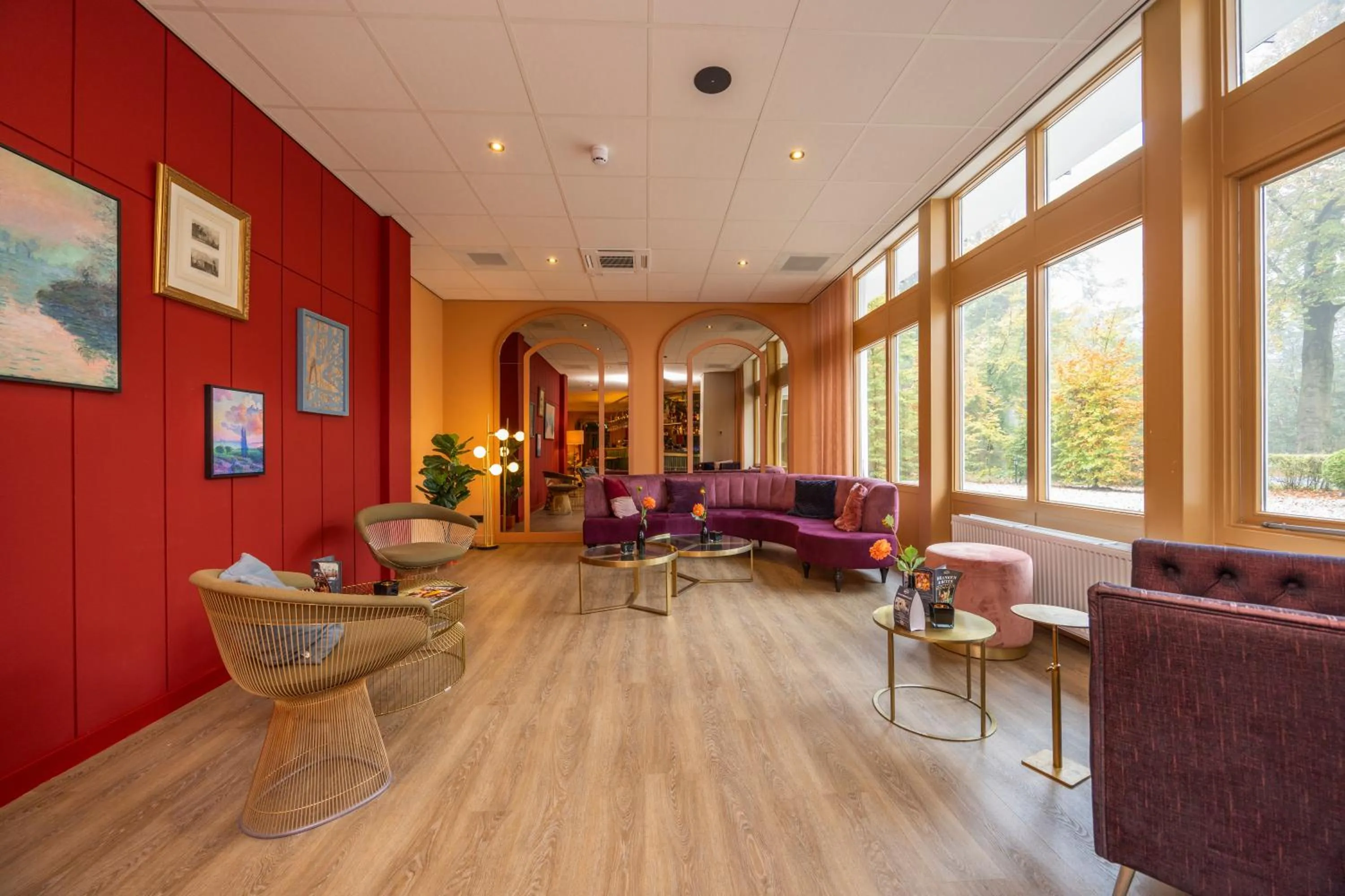 Communal lounge/ TV room in Fletcher Boutique Hotel De Mallejan