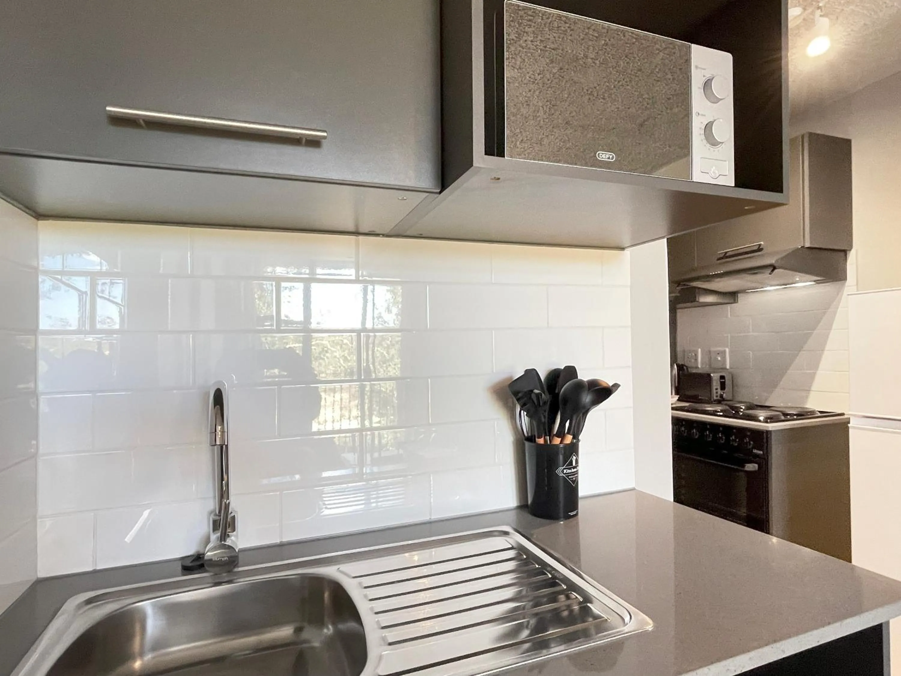 Kitchen or kitchenette in Circa Aparthotel by Totalstay