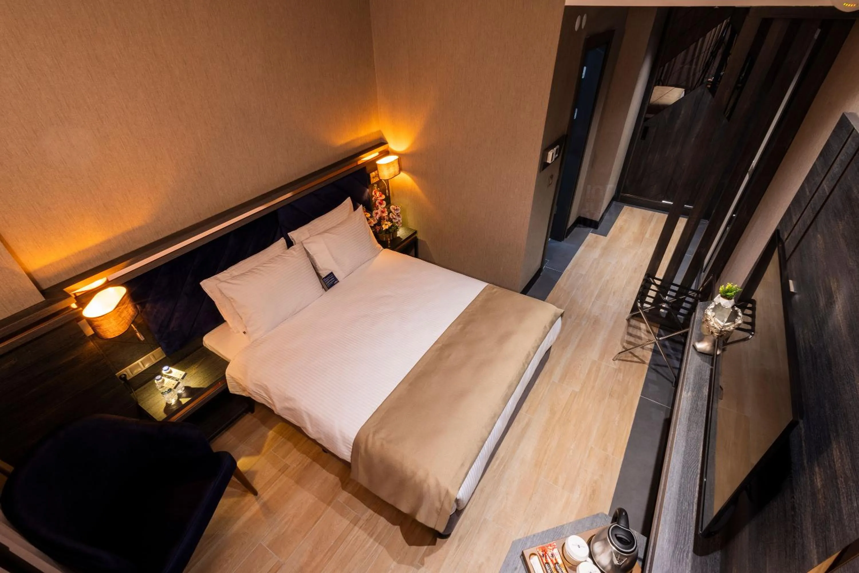 Bed in WestDoor Hotel