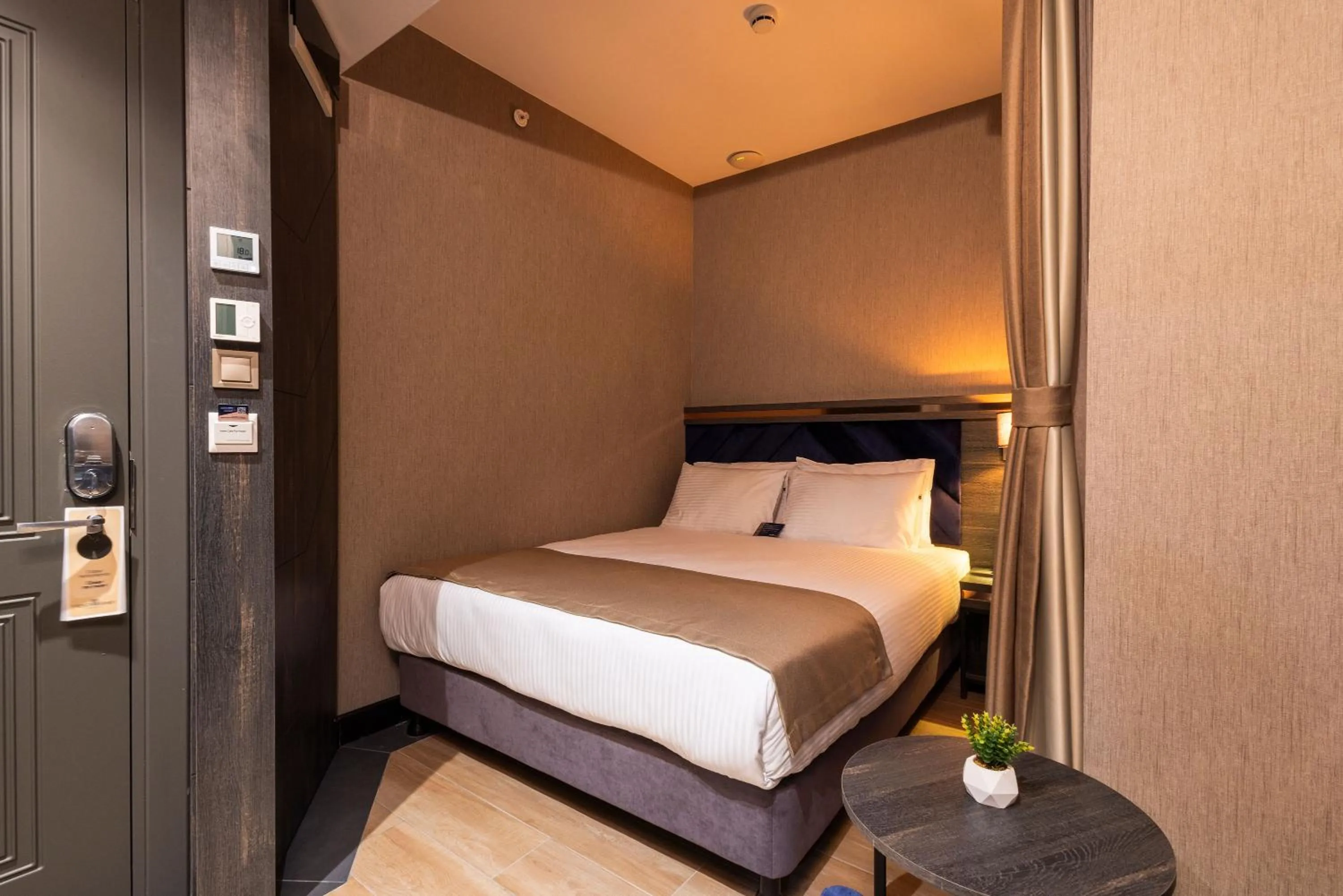 Bed in WestDoor Hotel