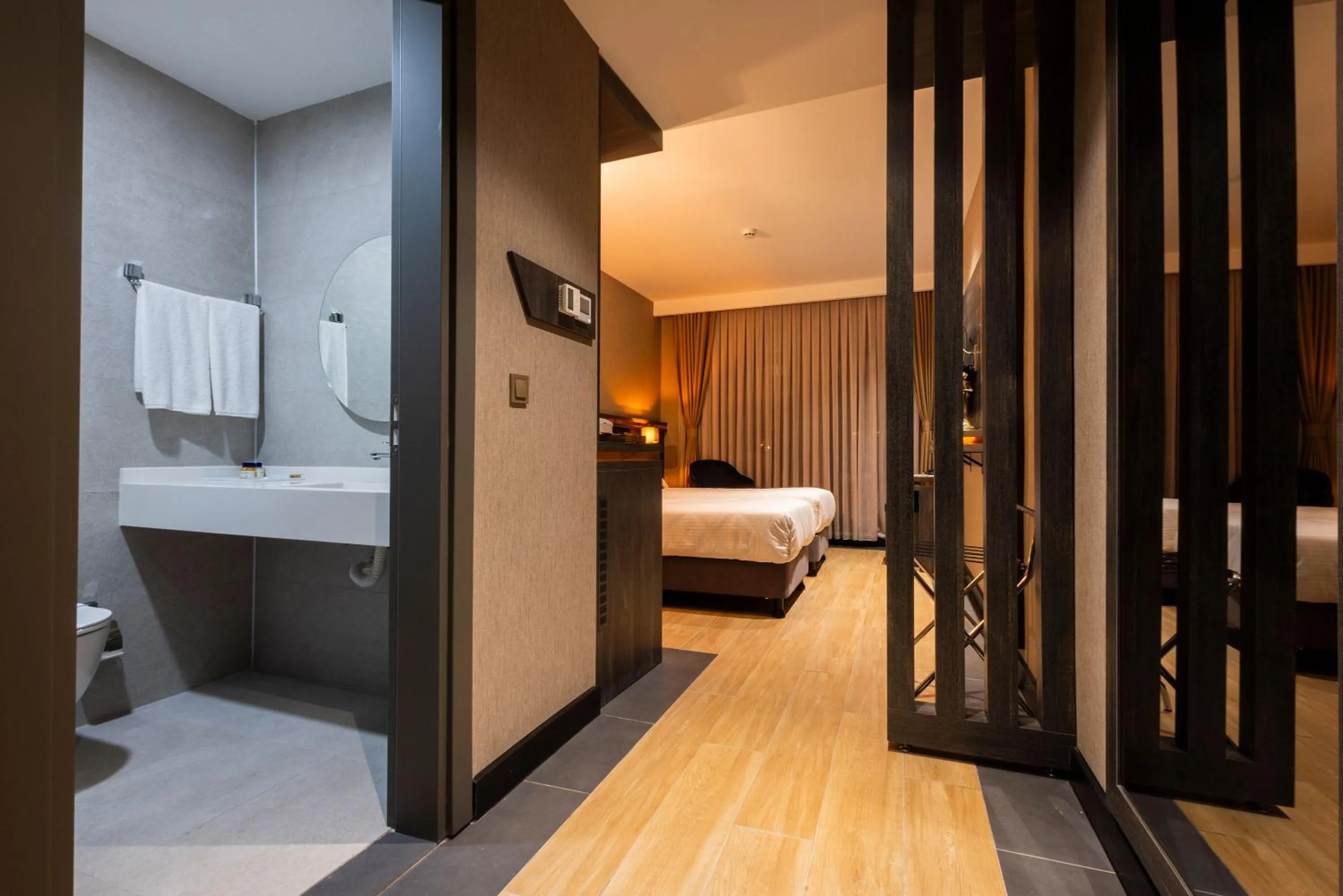 Toilet, Bed in WestDoor Hotel