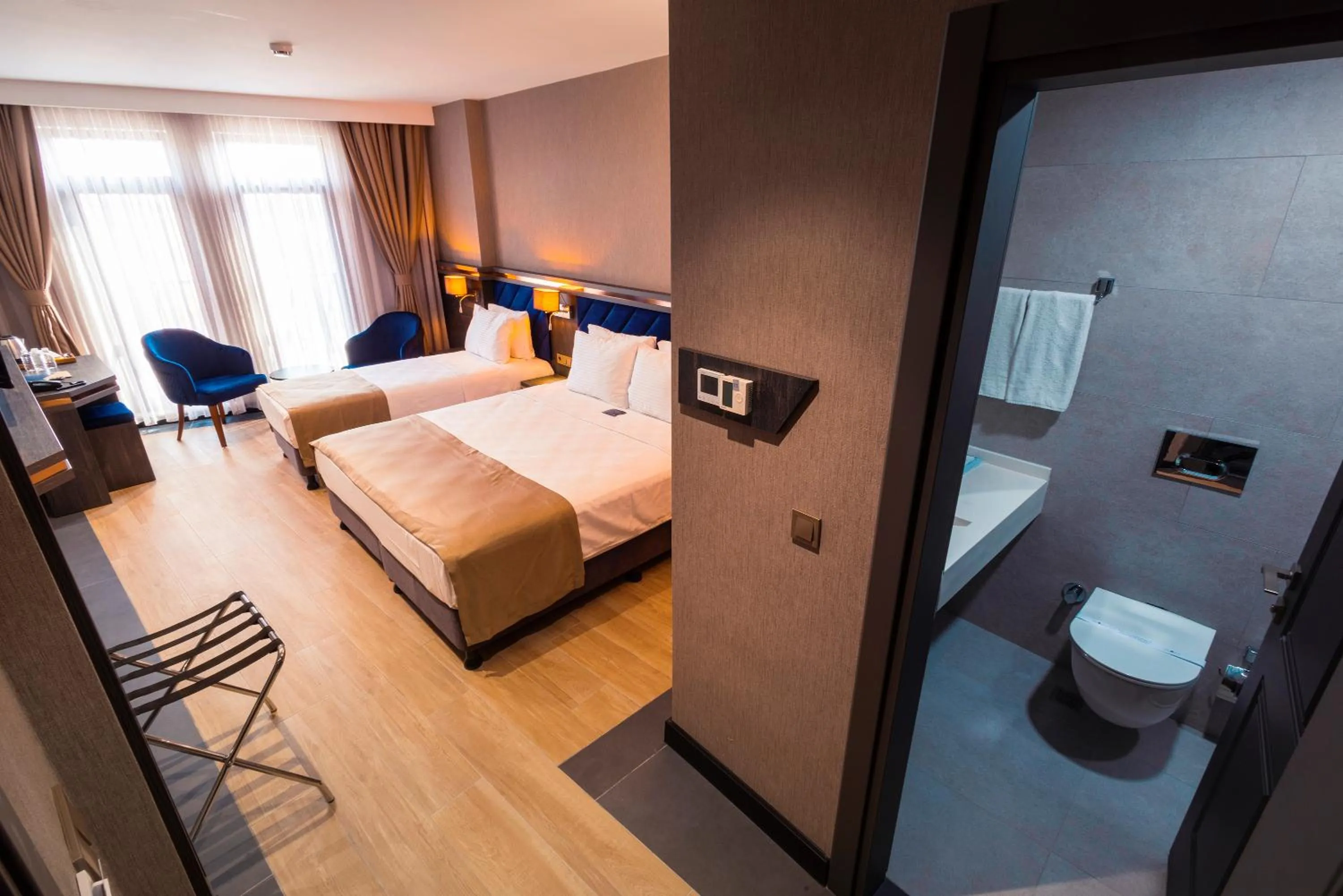 Toilet, Bed in WestDoor Hotel