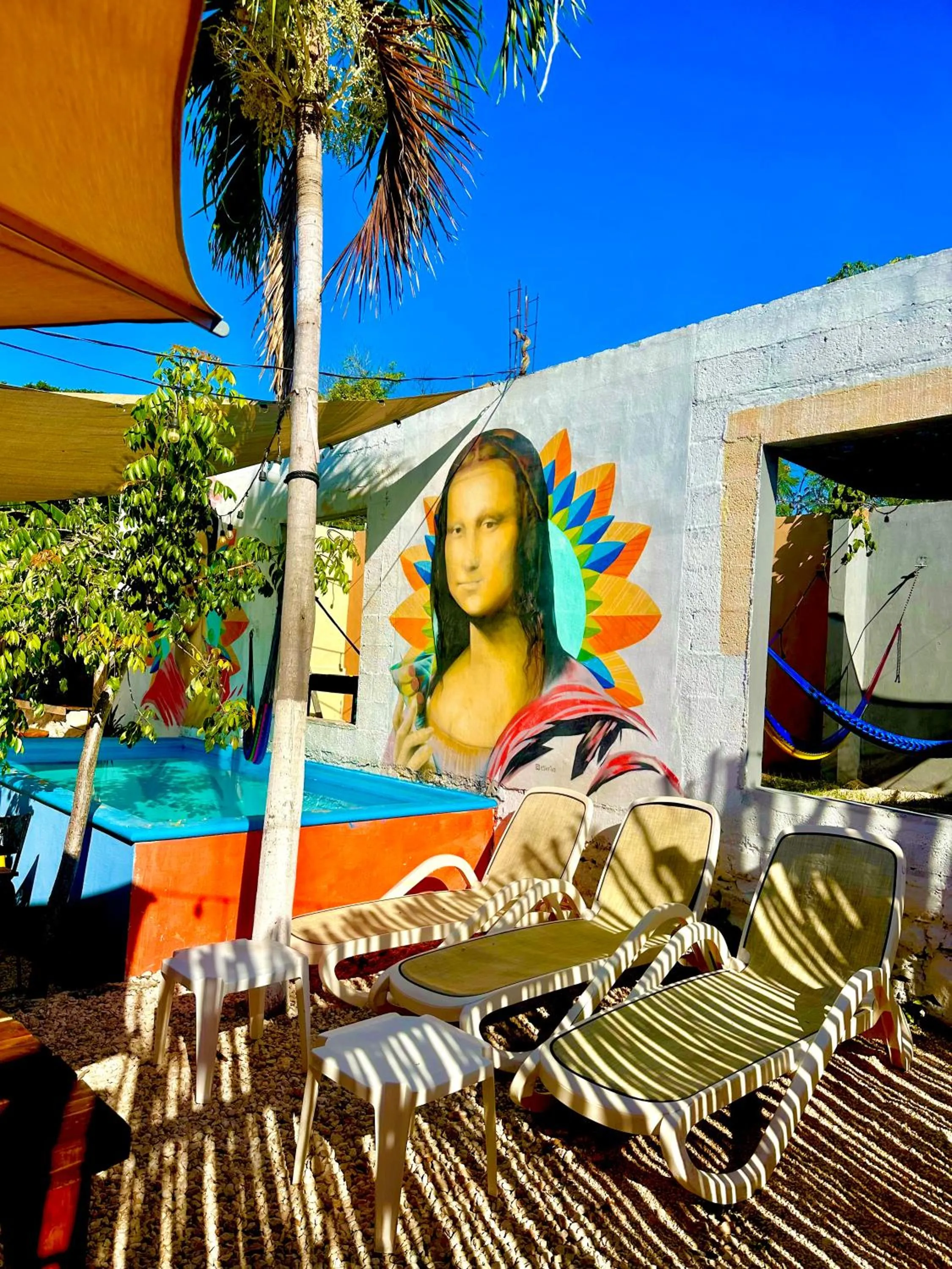 Swimming pool in Guacamayas Hostel and Social Laundry