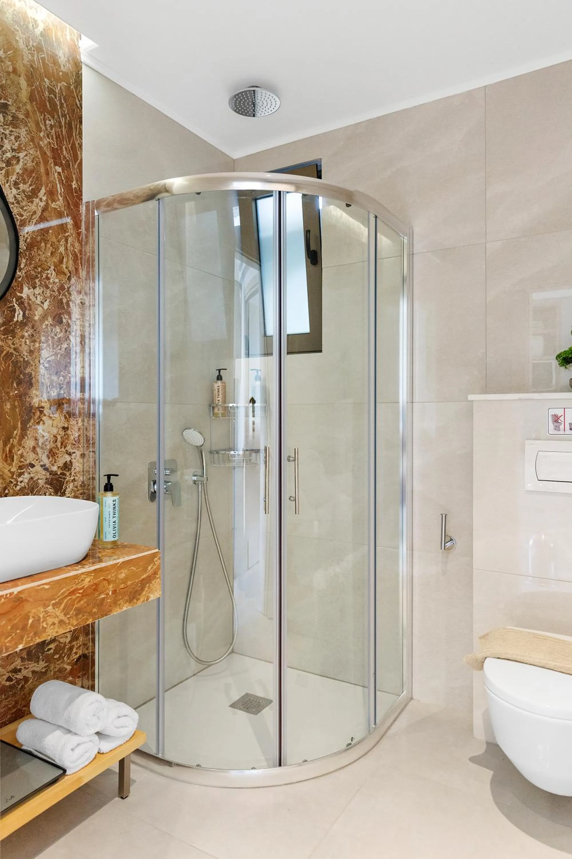 Shower in KOUROS STONE SUITES